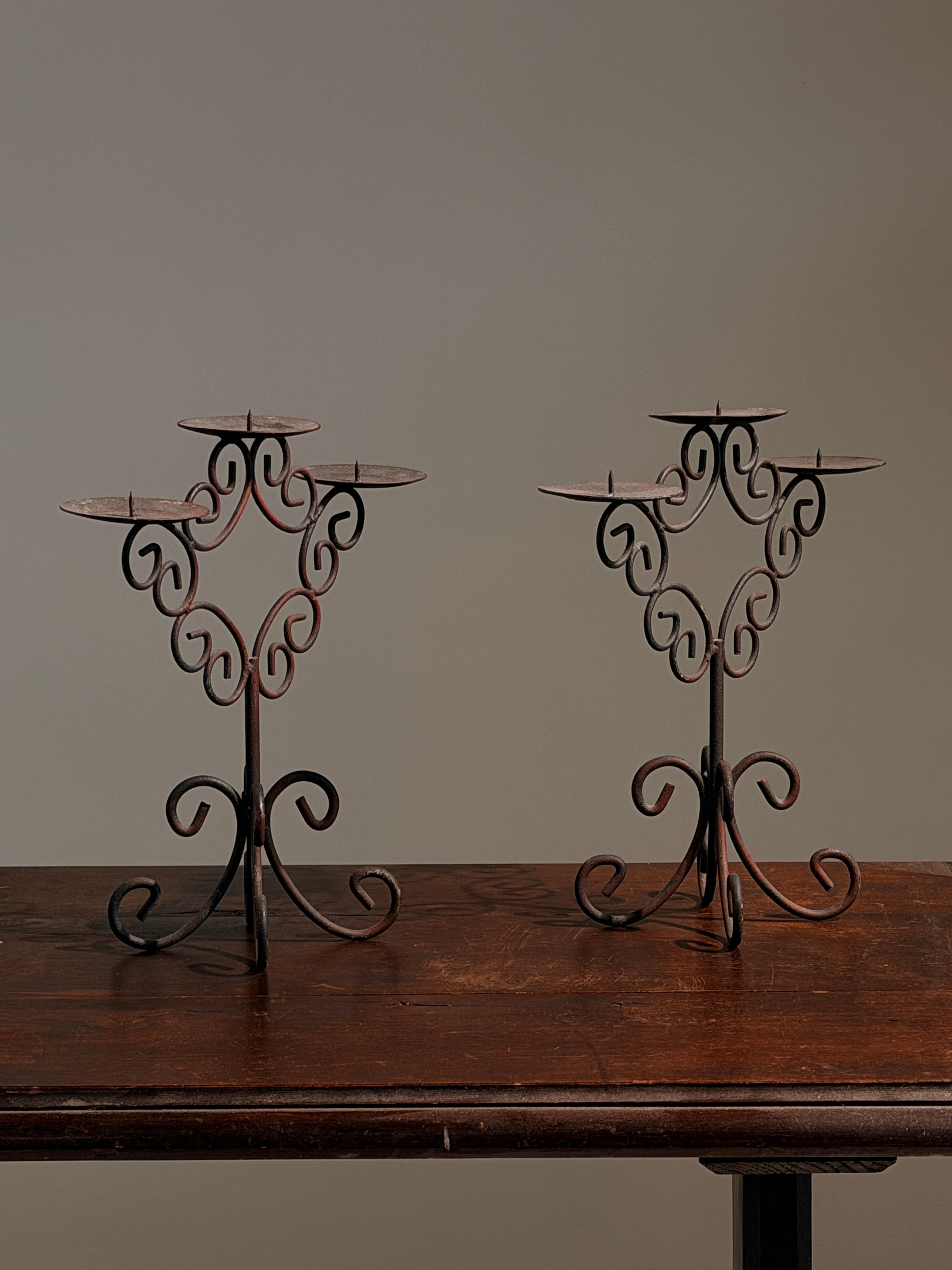 Pair of three-light wrought-iron candleholders, circa 1950 — close-up