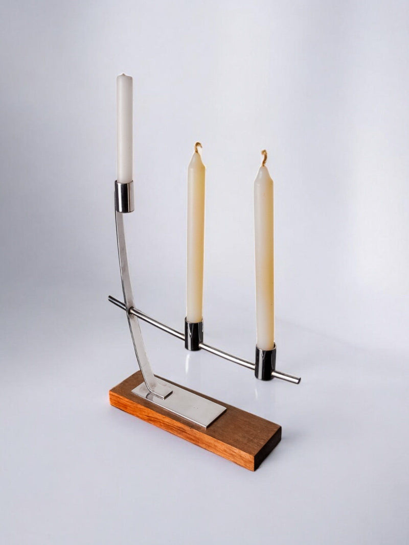 Candleholder in Stainless Steel and Rosewood, Denmark, 1970s — close-up of candleholder with wooden base