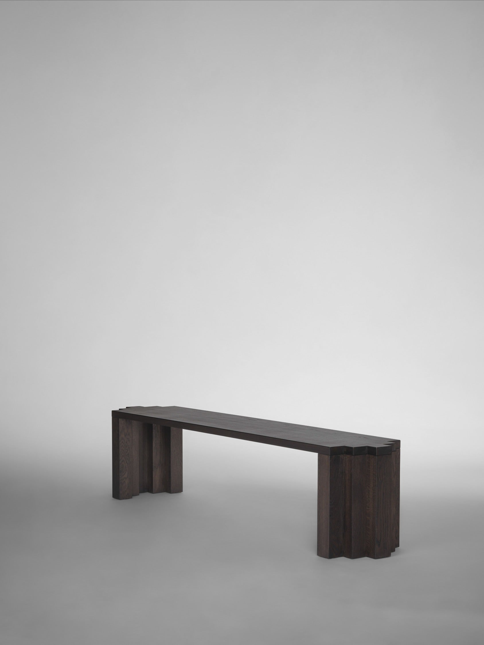 Cadence Bench — side view of dark wood structure