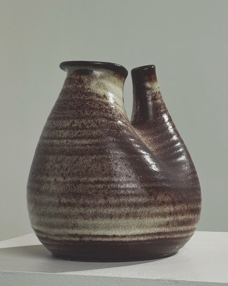 Zoomorphic ceramic vase side profile showing brown striped glazing