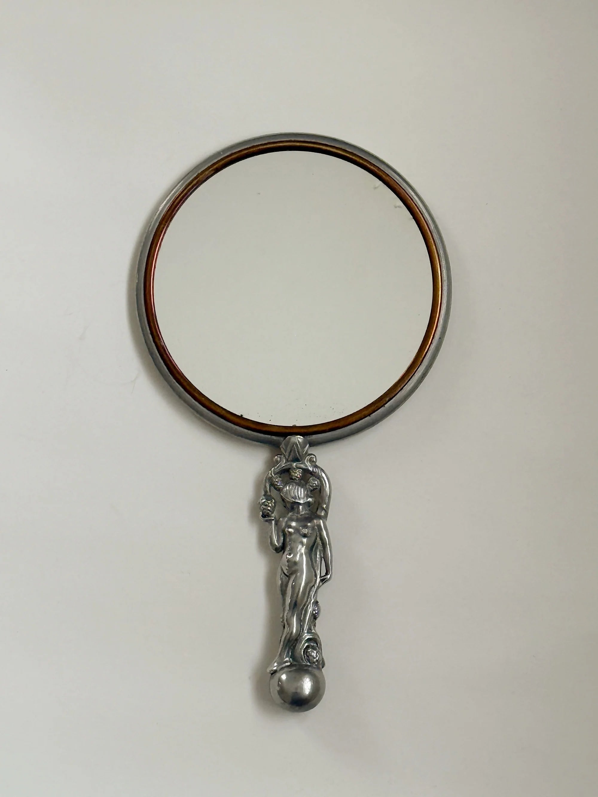 CG Hallberg Hand Mirror in Pewter, Swedish Grace, 1933 — top view of round mirror with pewter handle