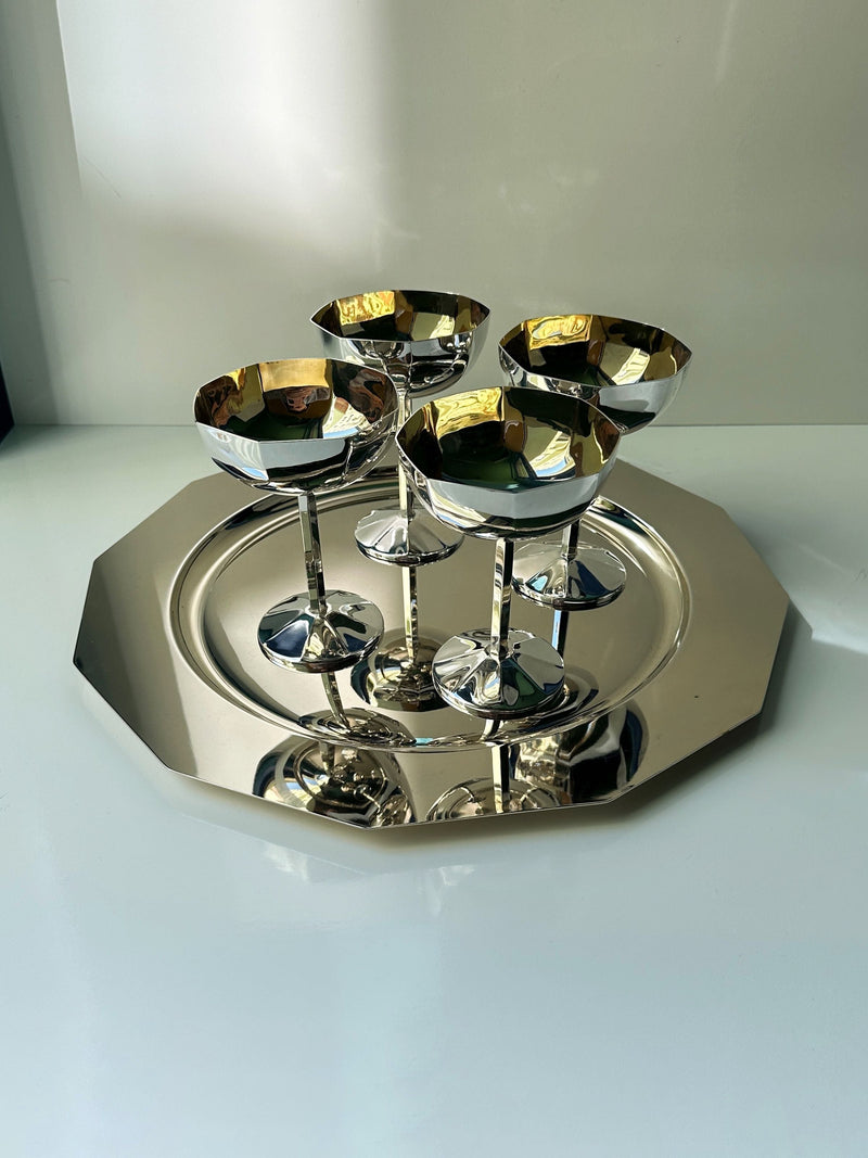Four Art Deco silver-plated champagne coupes on matching tray
