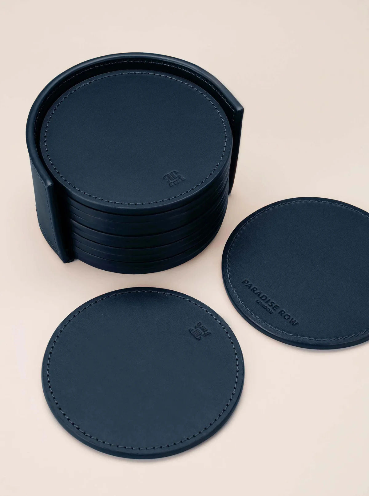 Leather Coasters in Holder (set of 12) — close-up of navy leather coasters