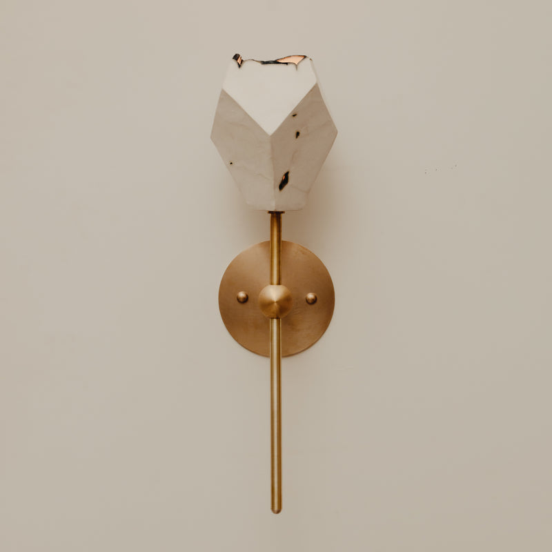 Relic Torch Sconce — close-up of white marble and brass details