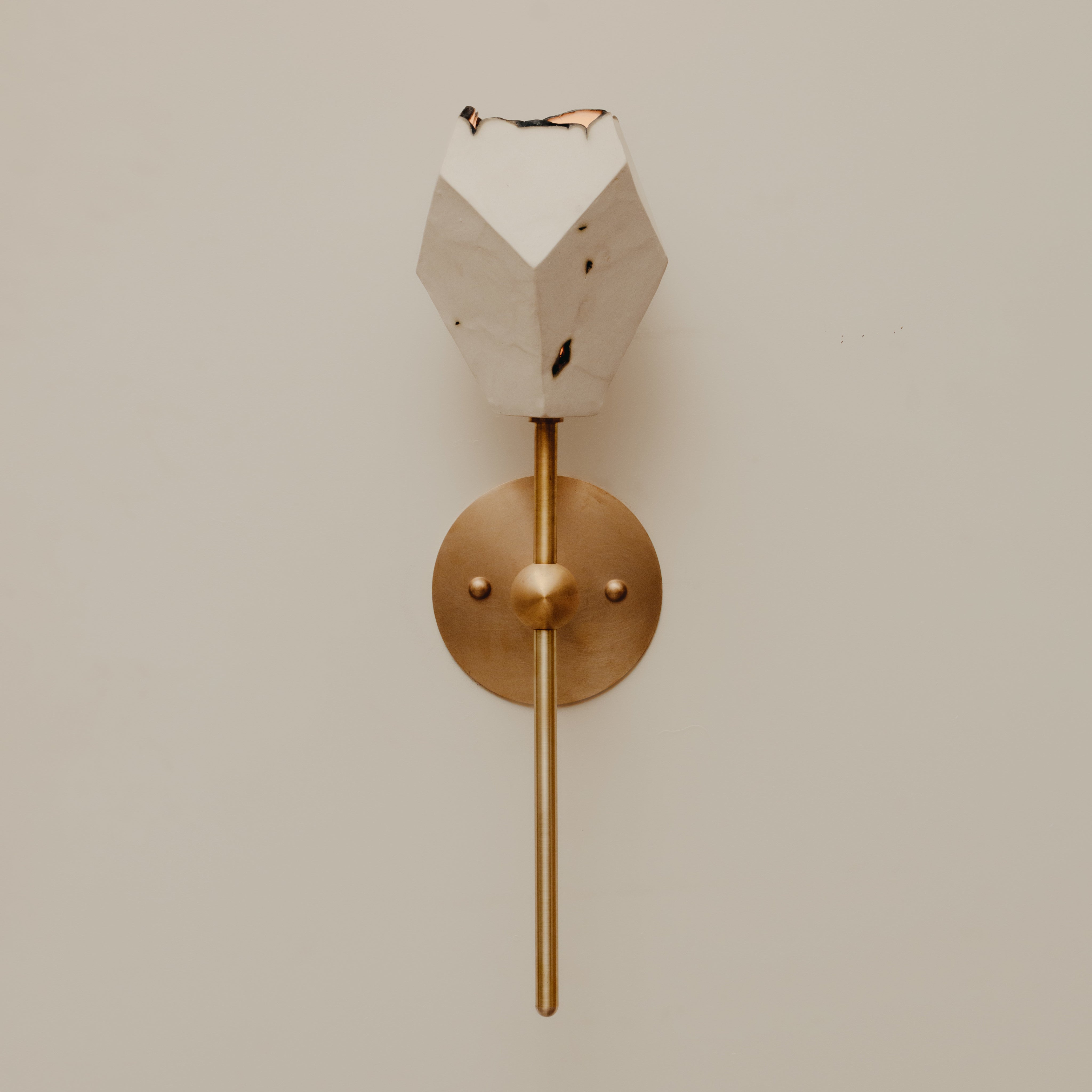 Relic Torch Sconce — close-up of white marble and brass details