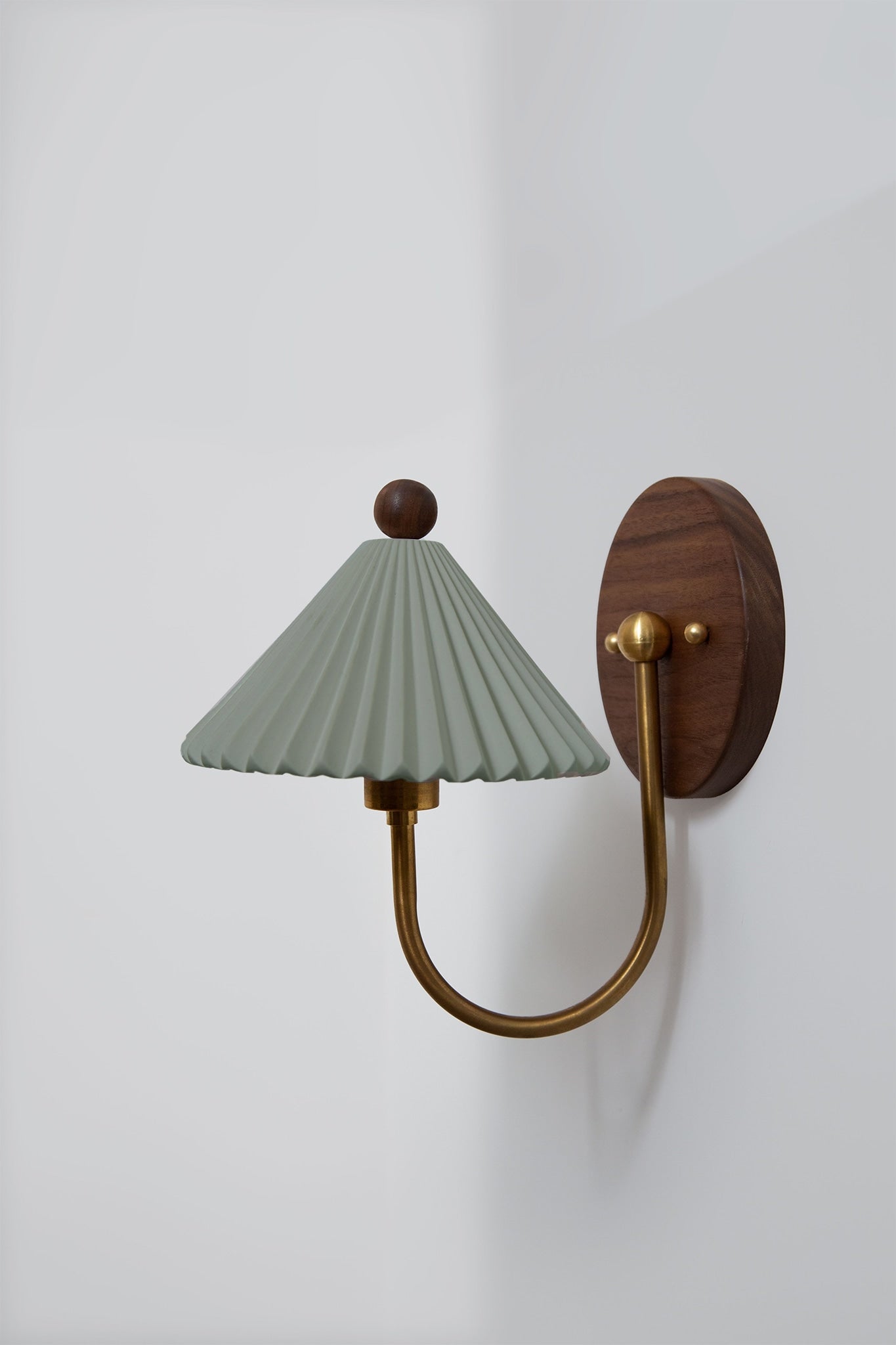 Prairie sconce wall light with sage pleated shade and walnut mount