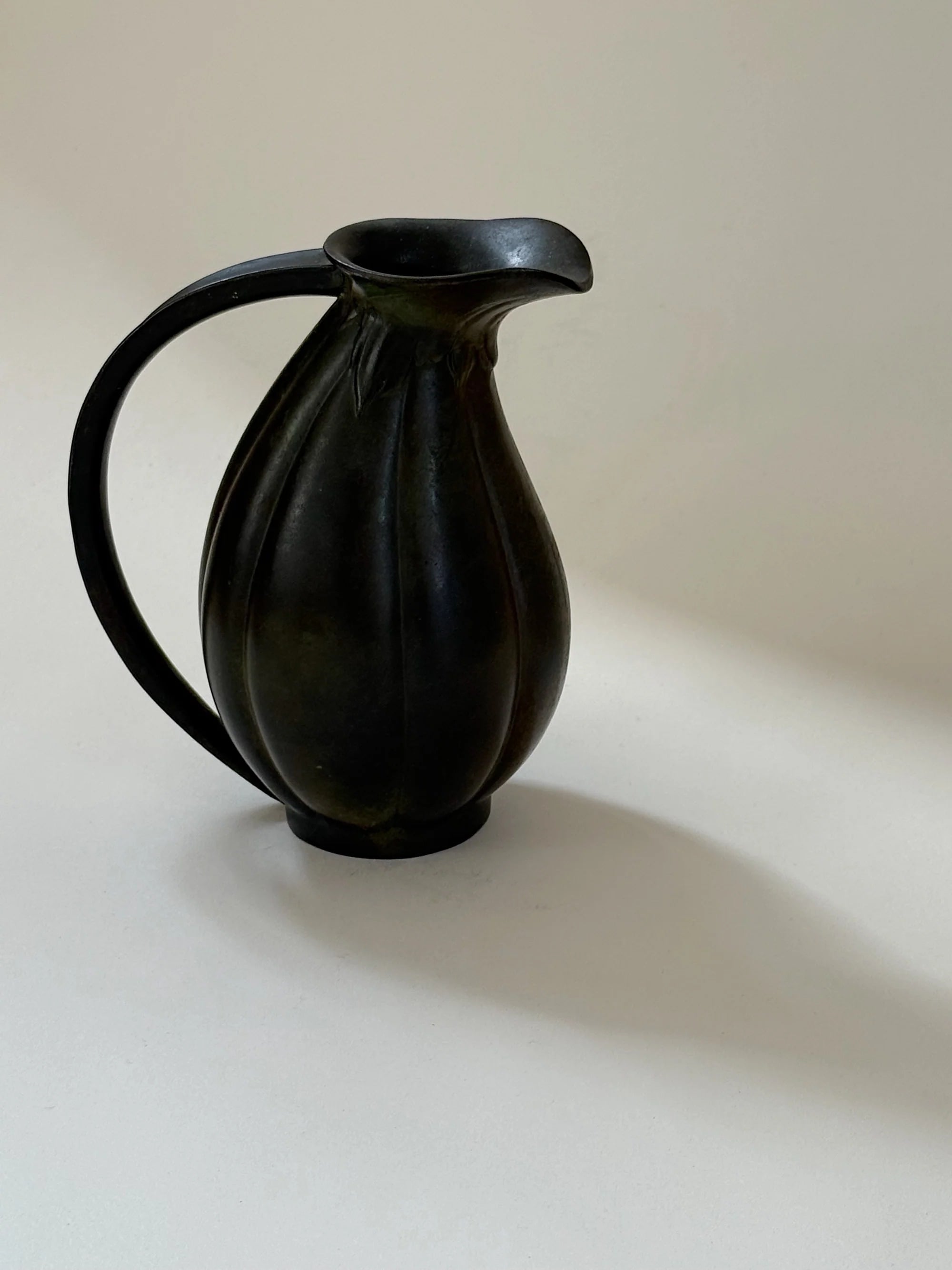 Danish Bronze Vase with Ribbed Form, 1910s — angled view on neutral background