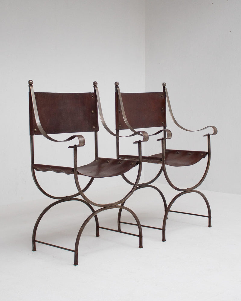 French pair of Iron Curule Chairs in Leather — close-up of leather seat detail