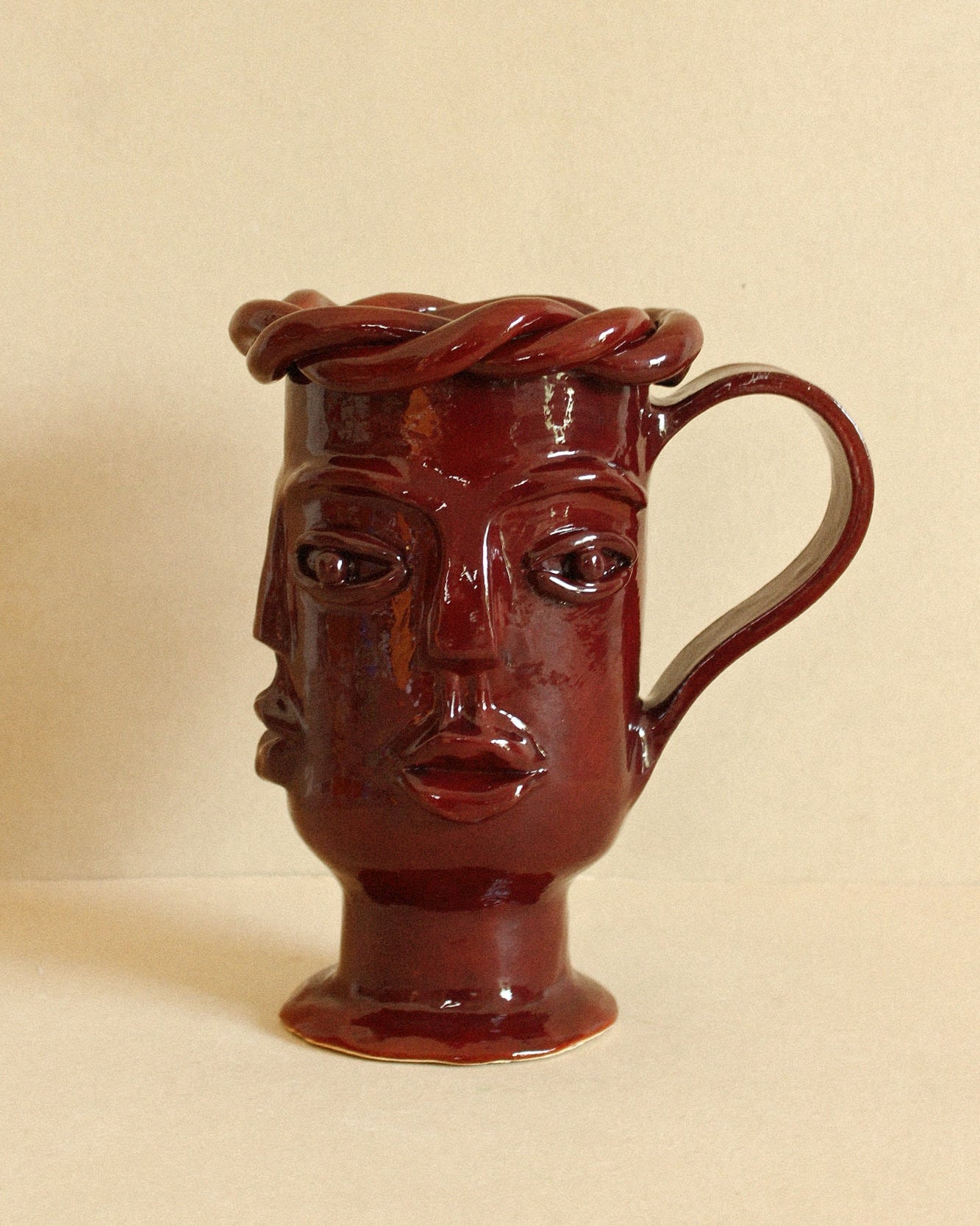Luzi Vessel (Oxblood) — side view highlighting handcrafted ceramic details