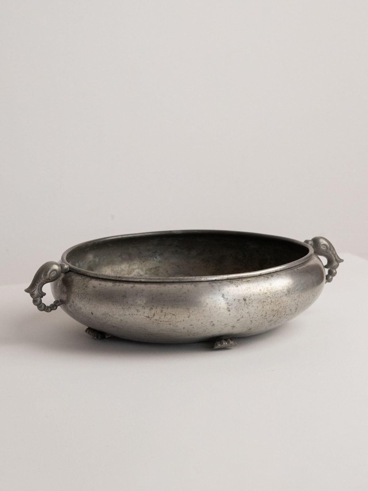 Footed Pewter Bowl with Bird or Dolphin Head Handles, Swedish Grace and Art Deco Idiom, 1930s — side angle