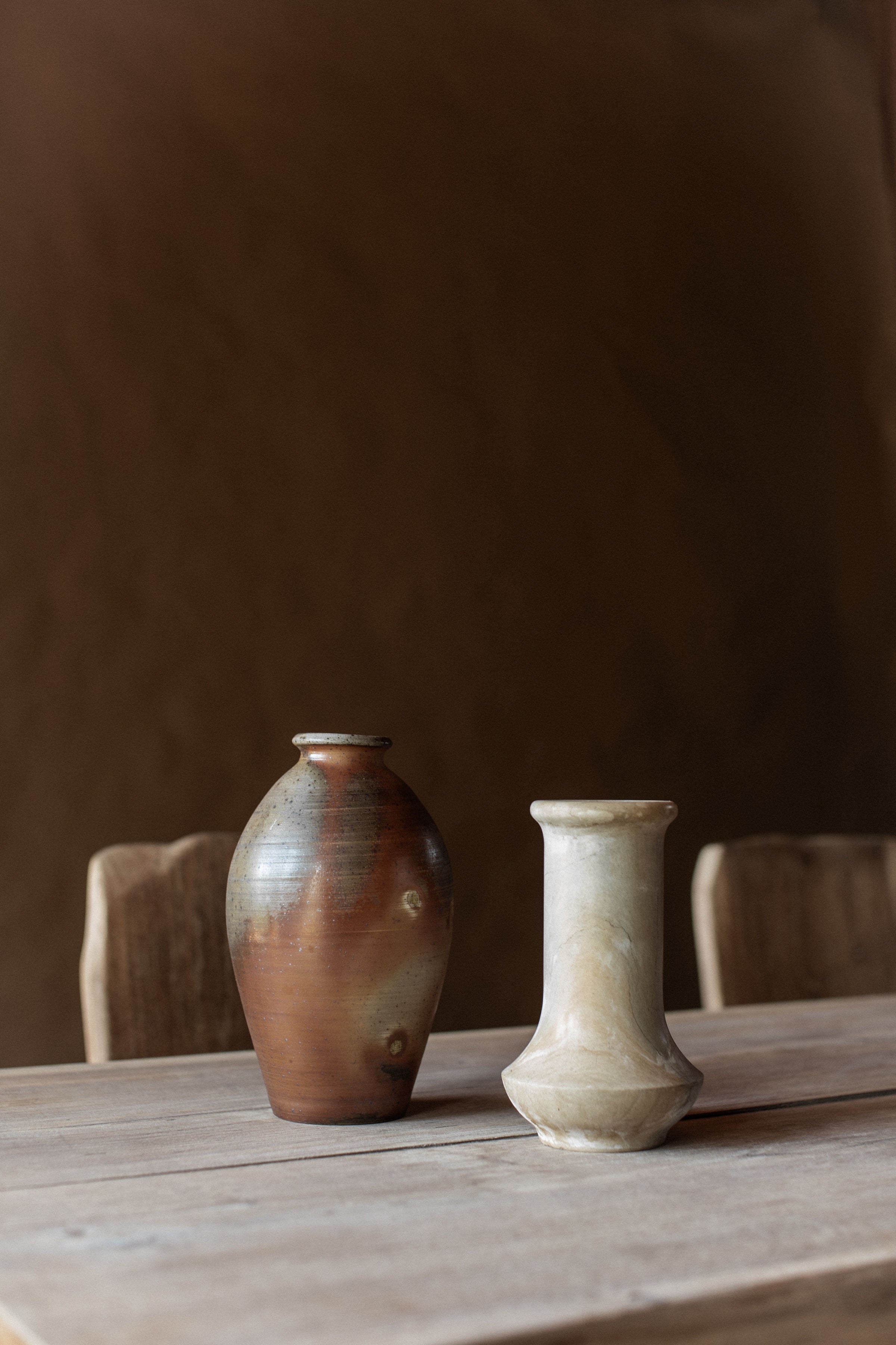 Vintage Ceramic Vase — two vases on rustic wooden table