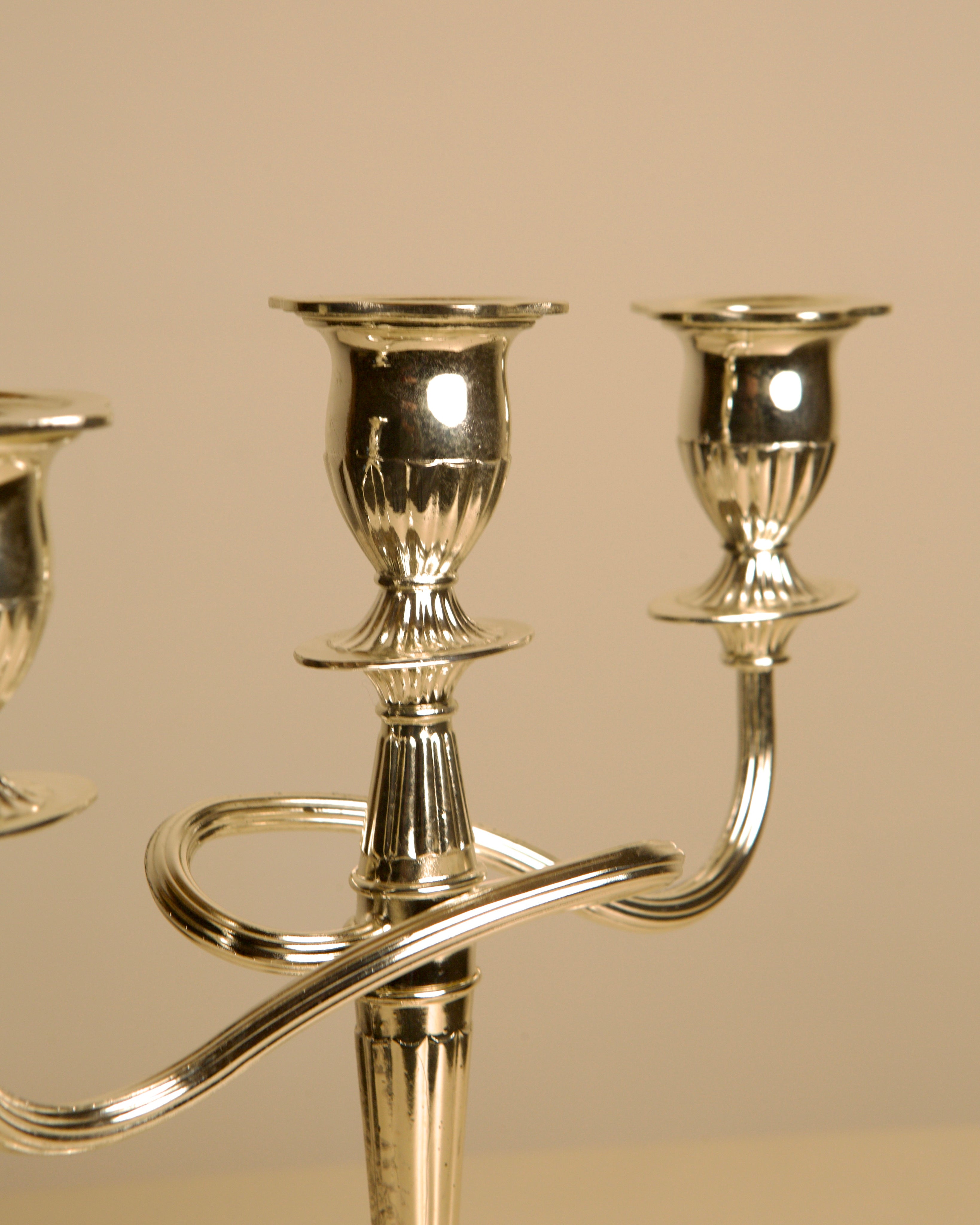 Polished brass Italian Medusa candelabra close-up detail view