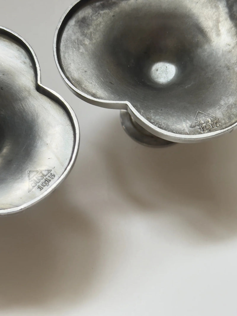 Pair of Pewter Candlesticks by Just Andersen — close-up of candle holder bases