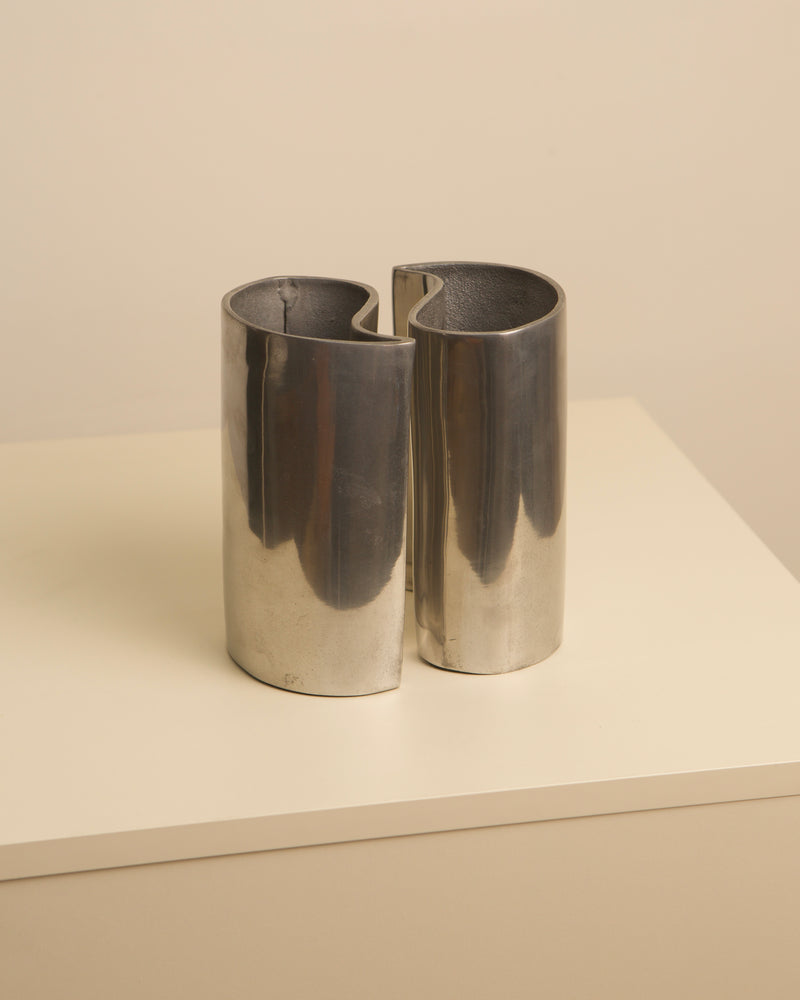 Pair of cast aluminum Yin Yang interlocking vases from the 1980s