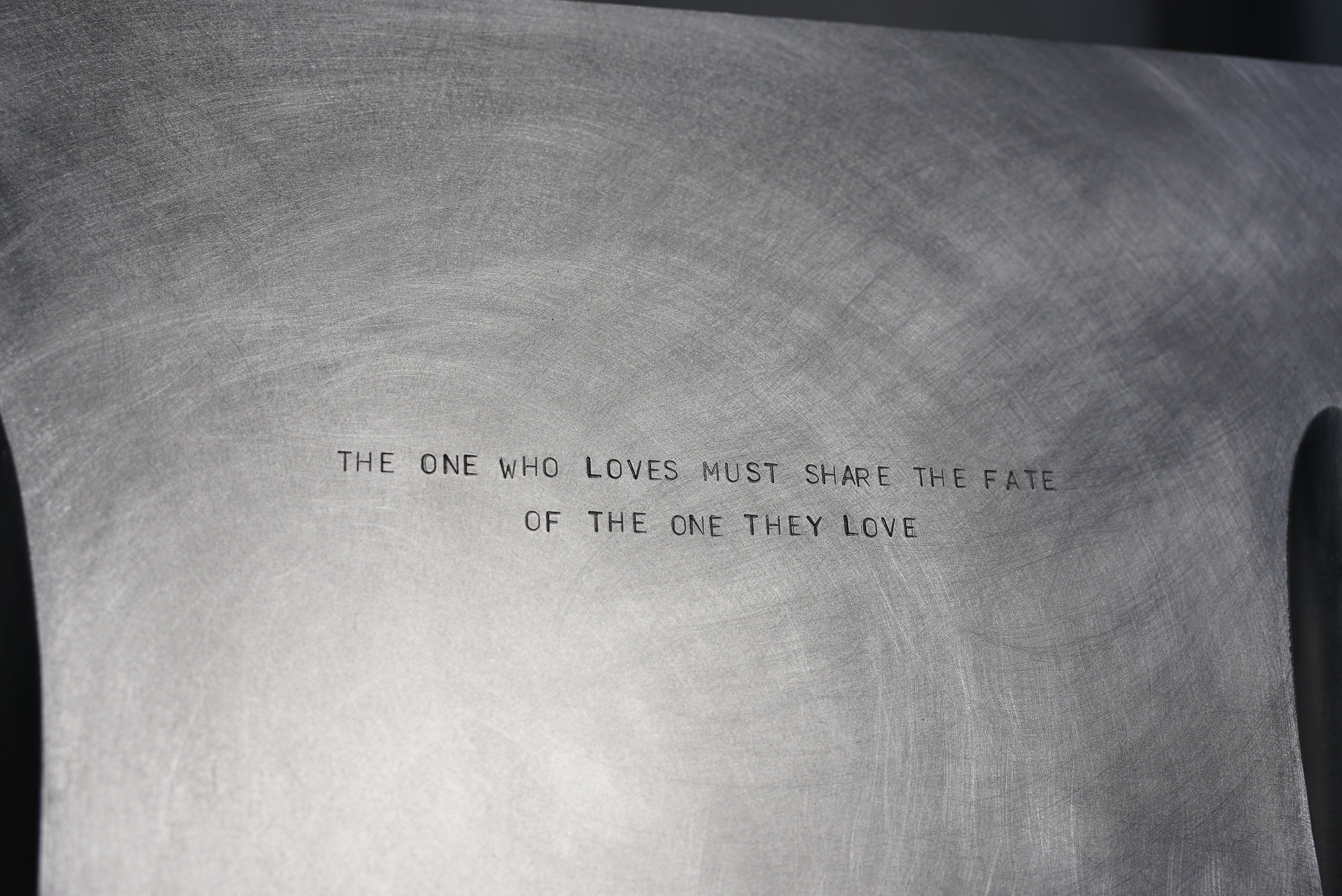 MASTER & MARGARITA — close-up of engraved metal surface