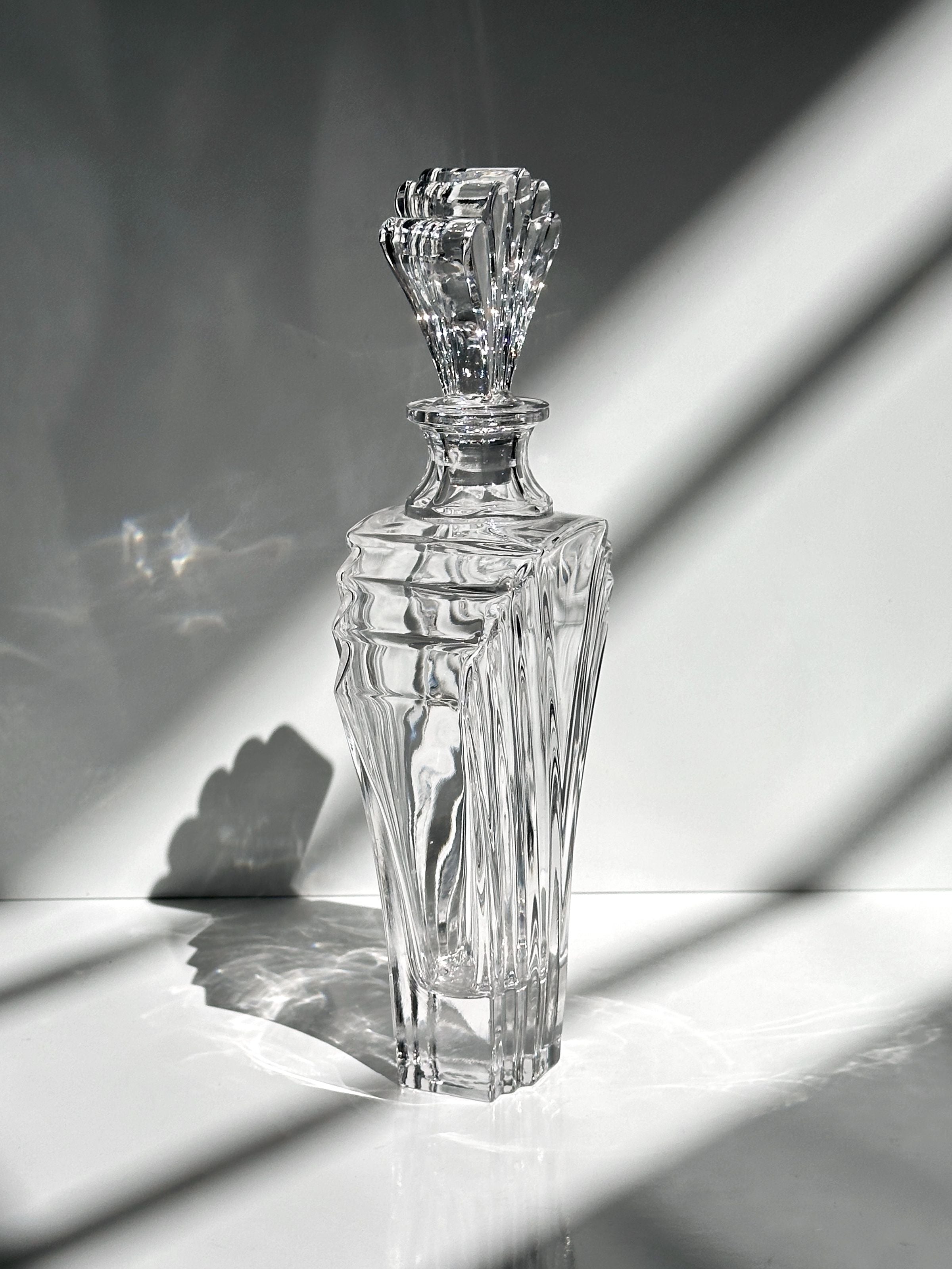 Italian crystal glass Art Deco decanter — angled view with light reflections