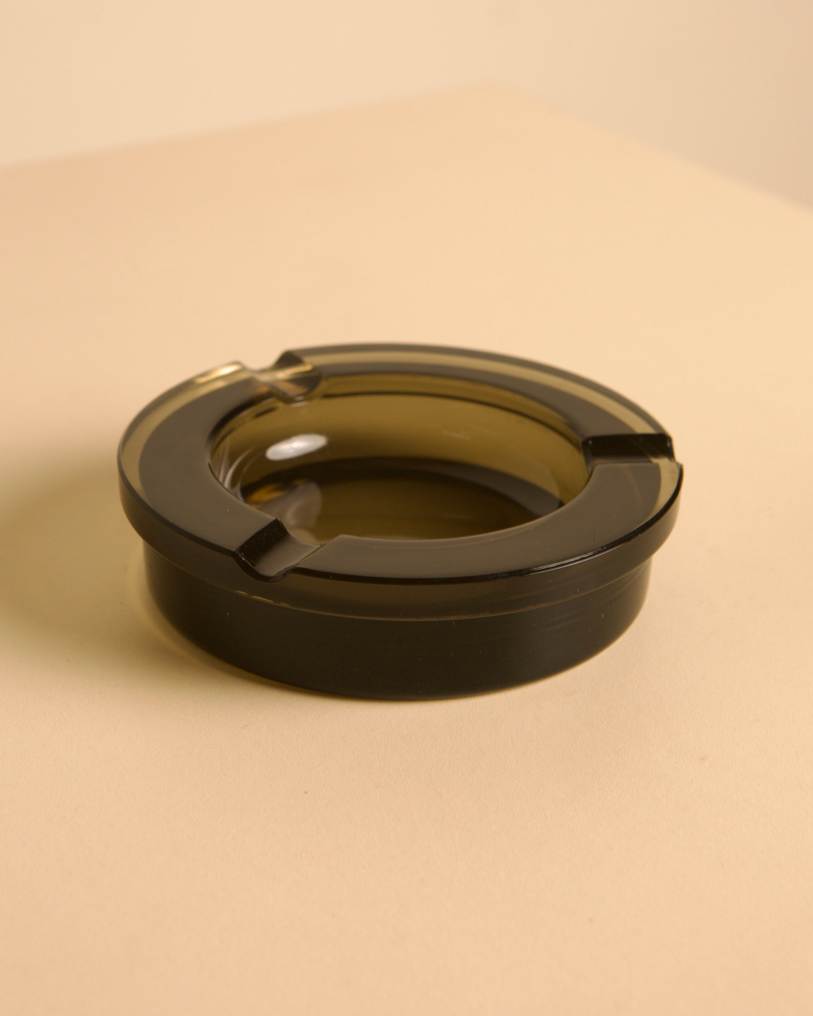Italian circular metal and amber glass ashtray, 1970s — close-up