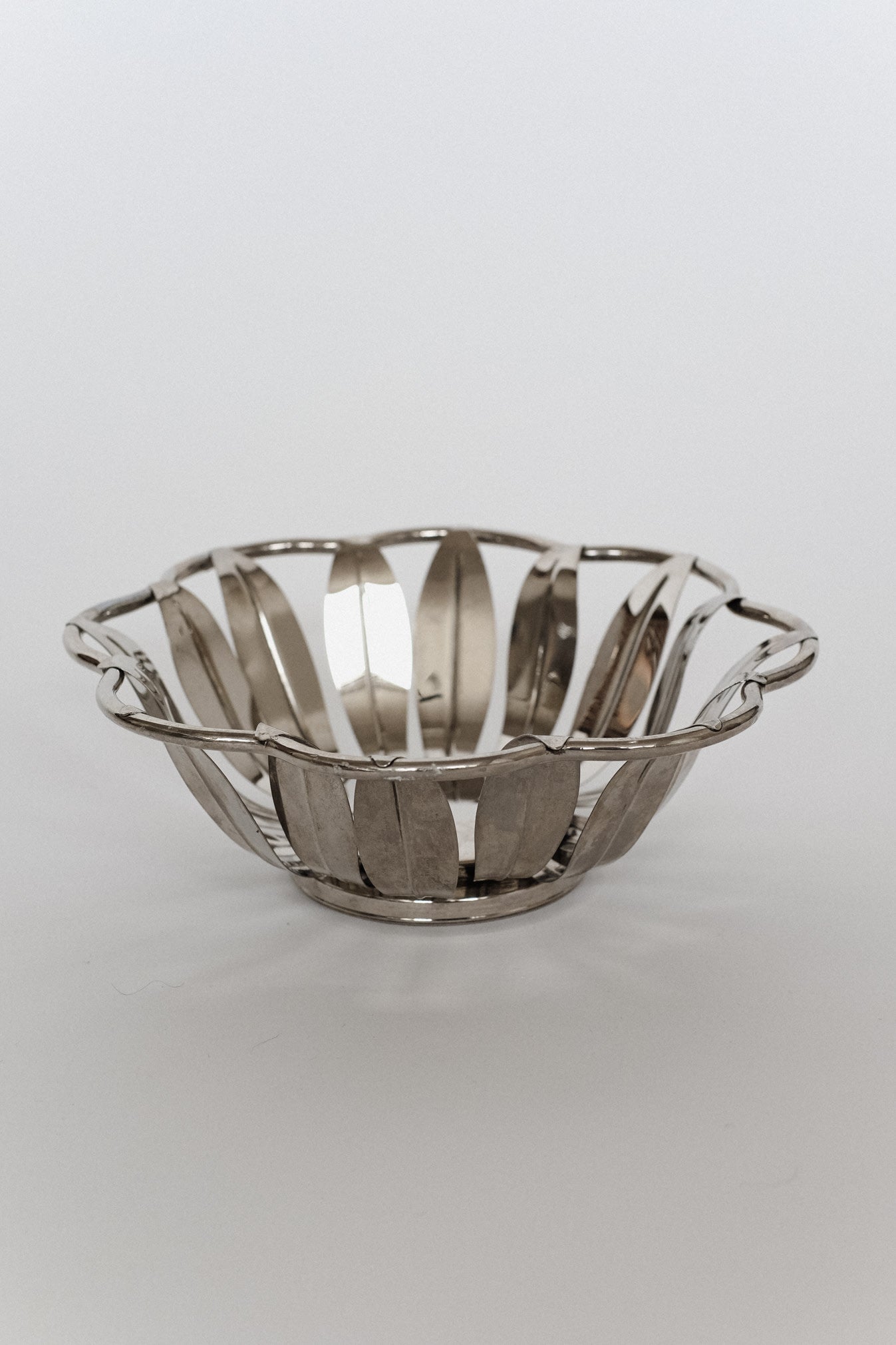 Silver-Plated Bread Basket — back view highlighting open design and reflective surface