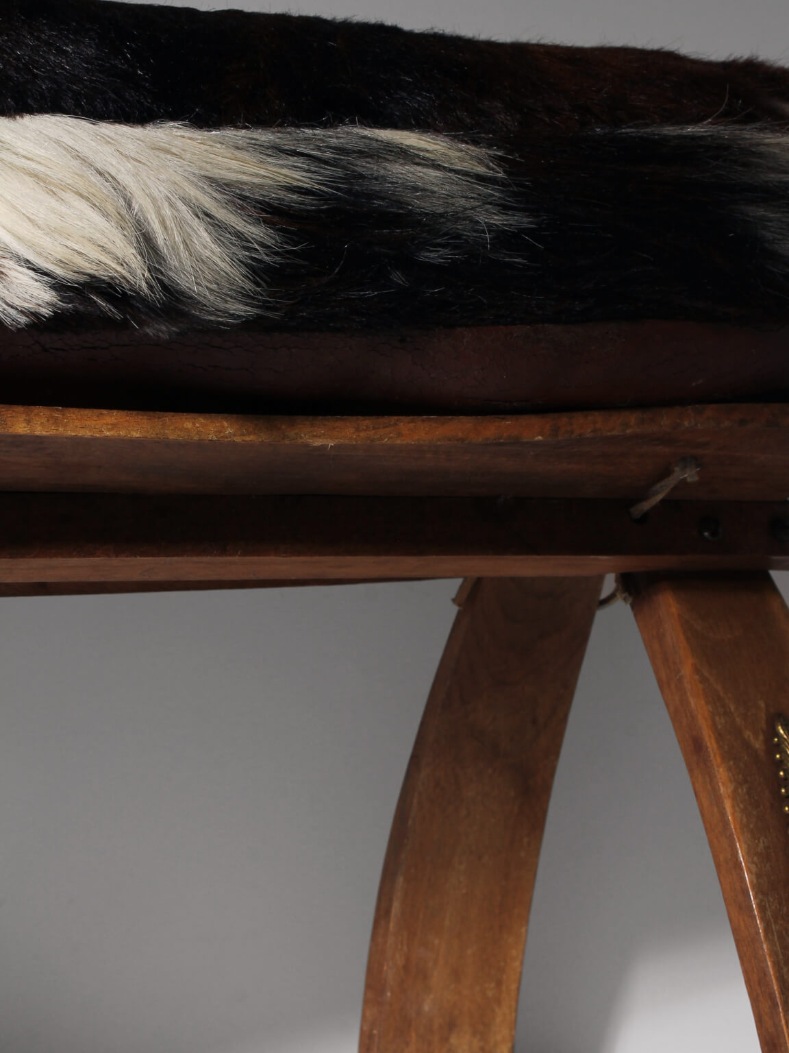 Cowhide Camel Saddle Stool — lifestyle setting