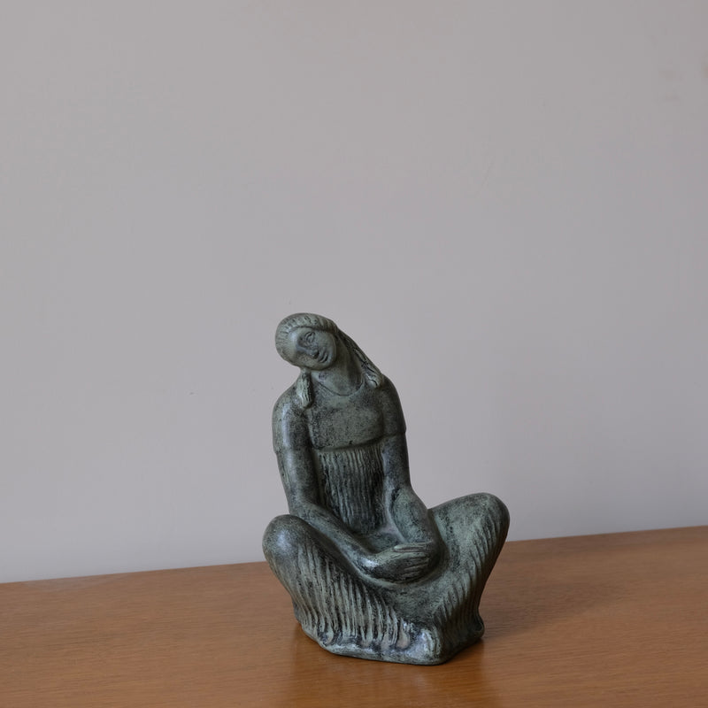 Fidel Aguilar Marco Ceramic Sculpture | Spain | 1930s — close-up of green ceramic figure on wooden surface