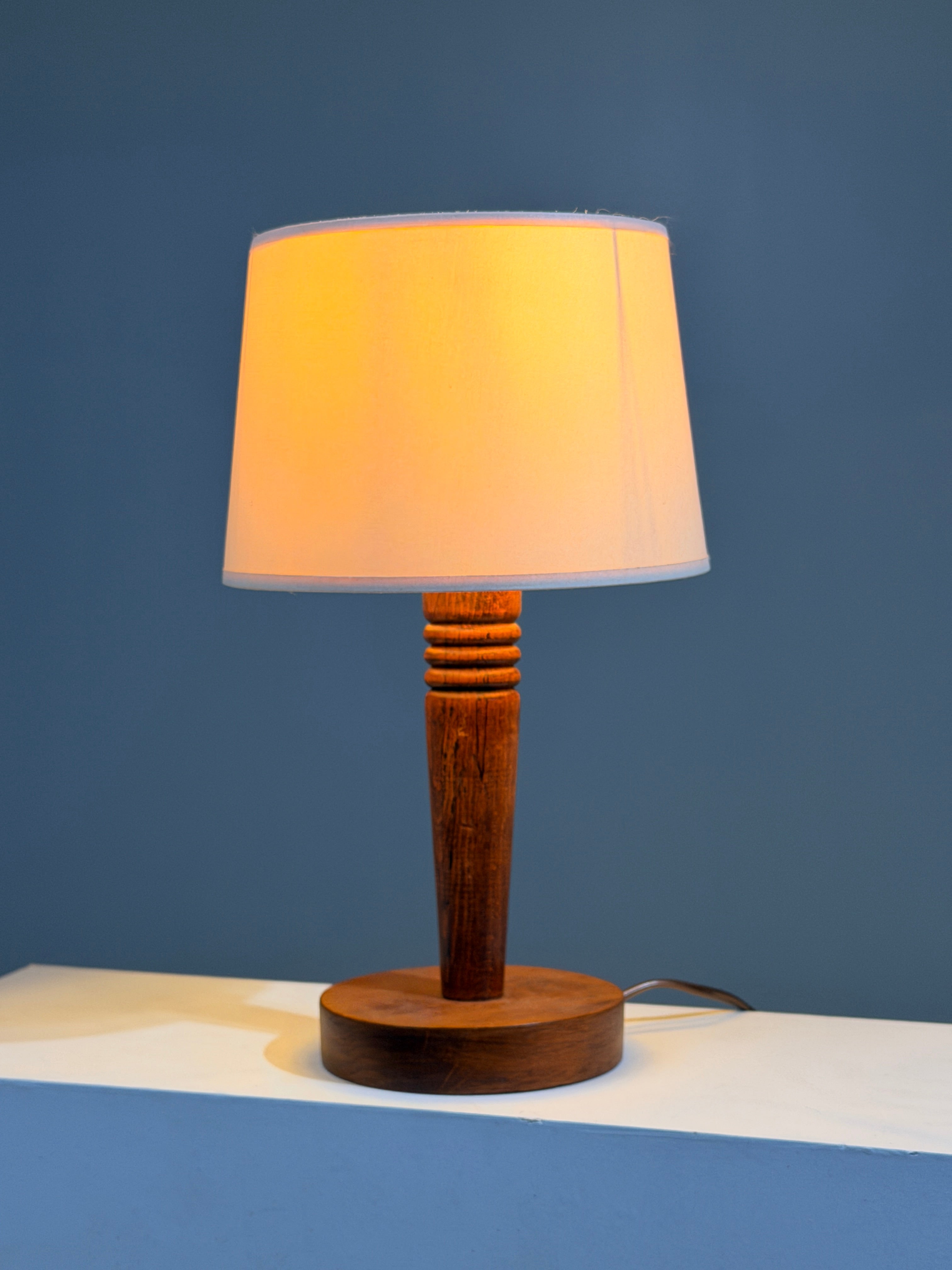 Art Deco carved wood table lamp, France, circa 1930.  — side angle