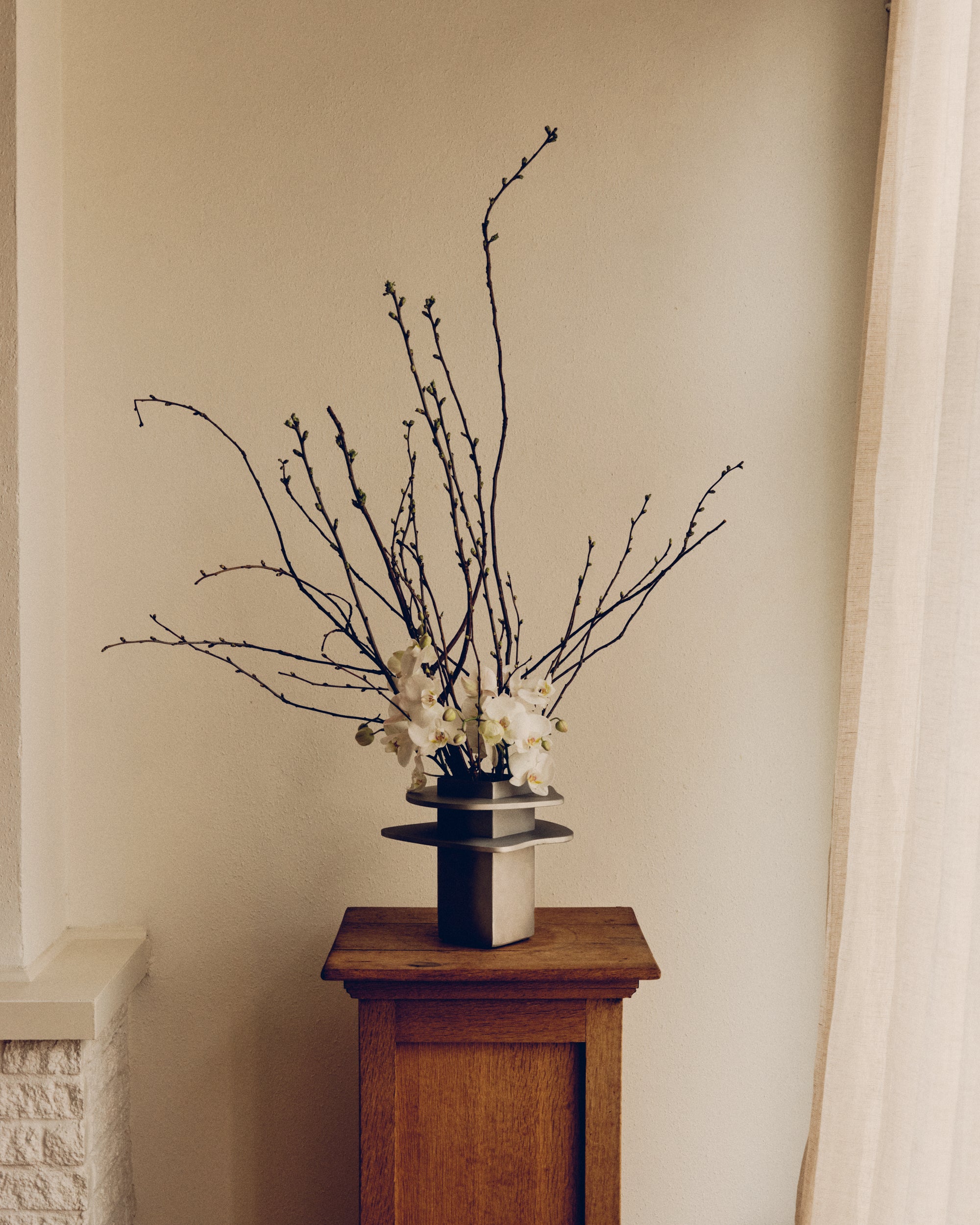 Flange Vase — top view with branches and flowers in a modern setting
