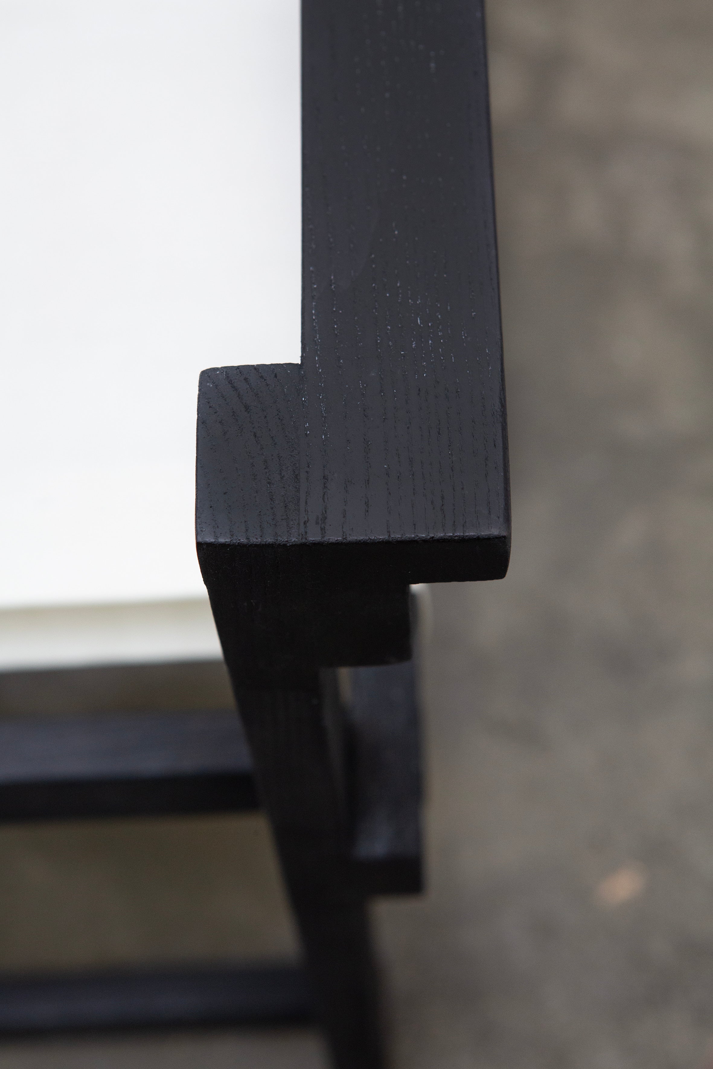Modernist Dutch Chair after Gerrit Rietveld (1-6) — close-up of black wooden armrest
