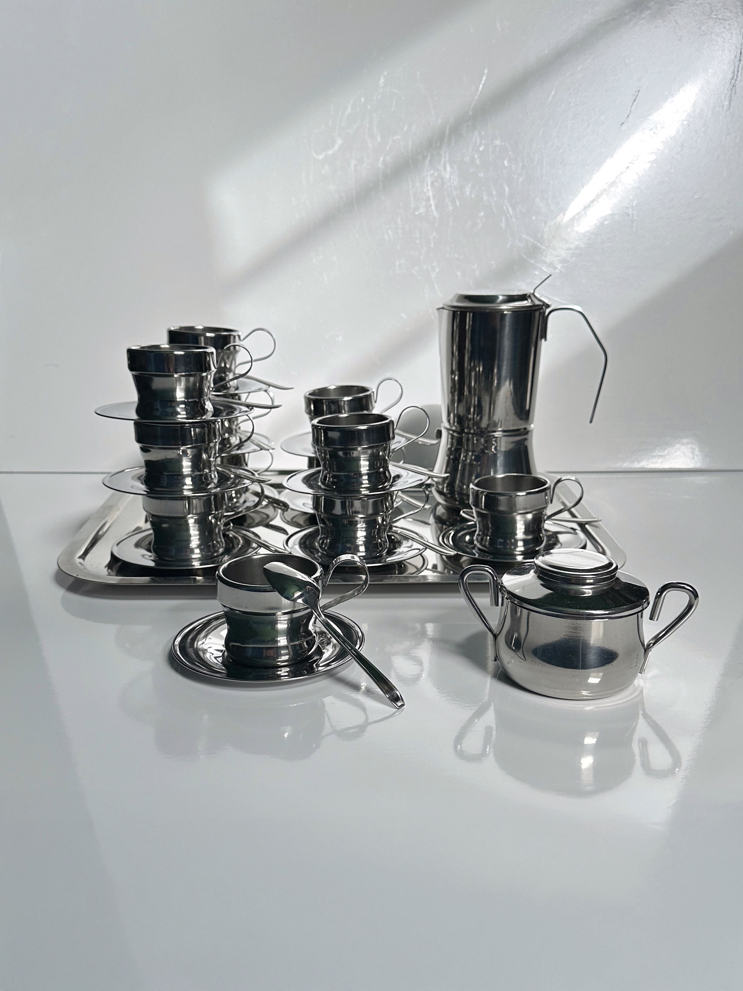 Italian Stainless Steel Coffee Set for 12 Persons — top view on white surface
