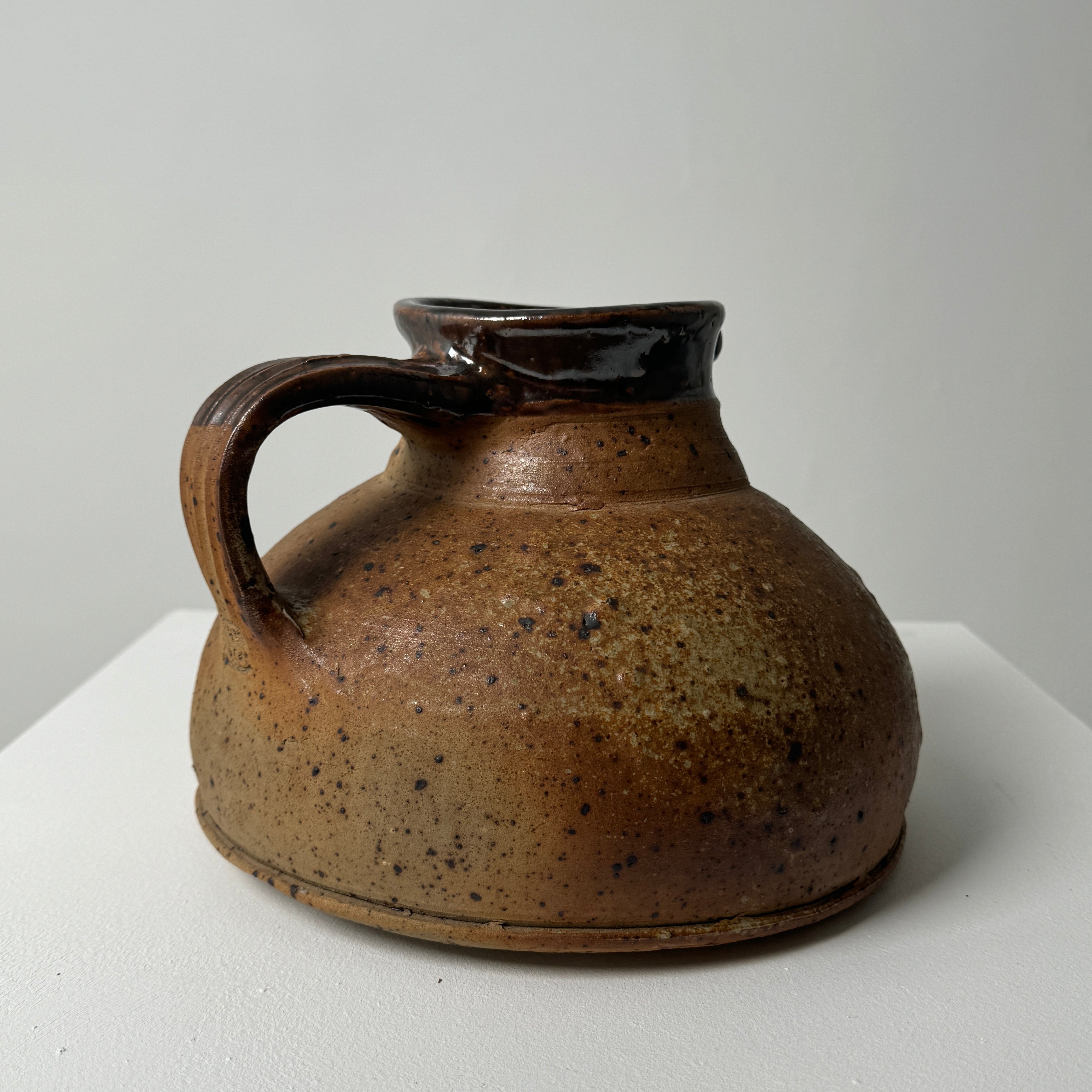 Brown stoneware pitcher with speckled glaze by Pierre Digan