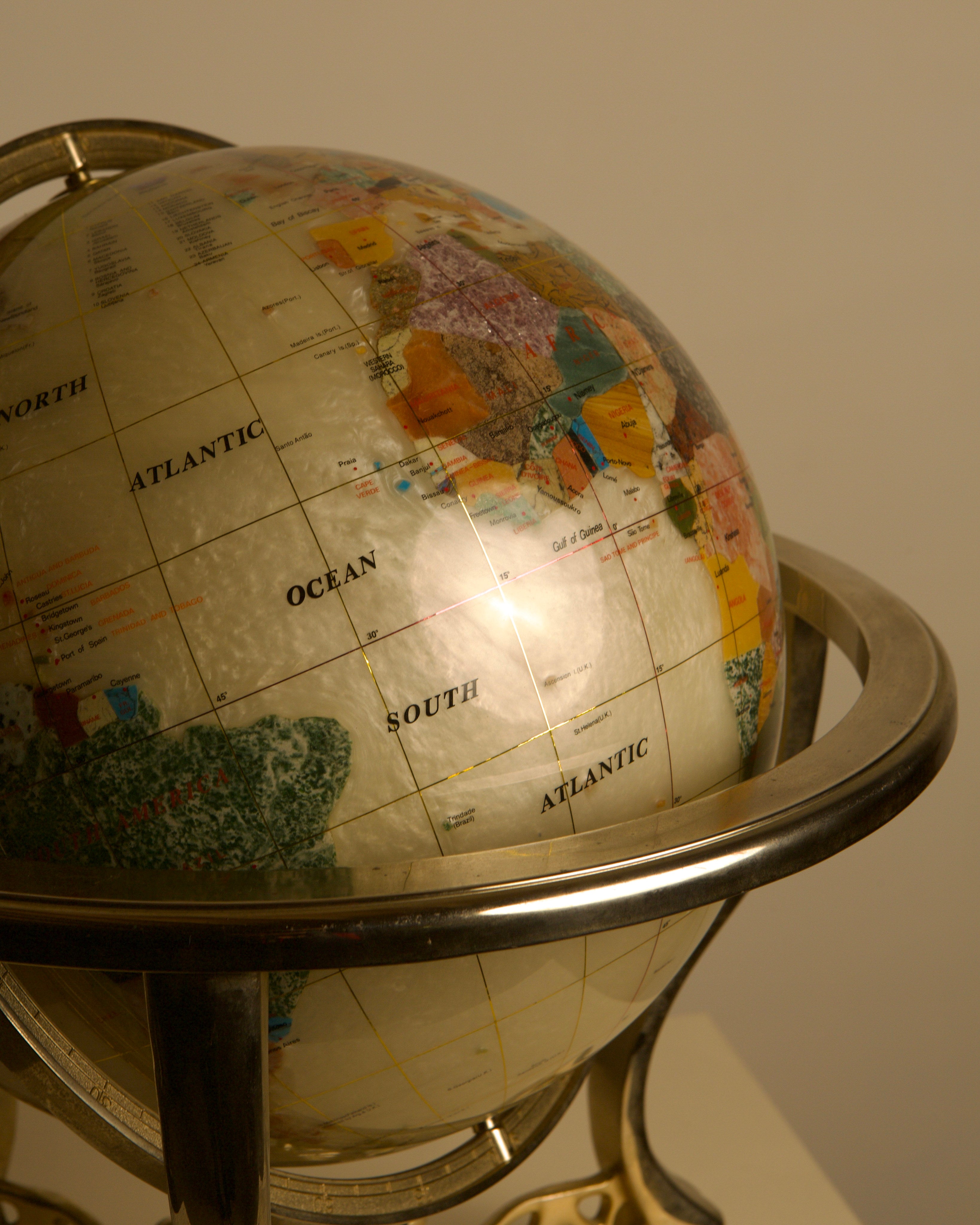 Large Globe Made of Hardstone and Mother-of-pearl, 1970s — side angle showing detailed map and metal stand