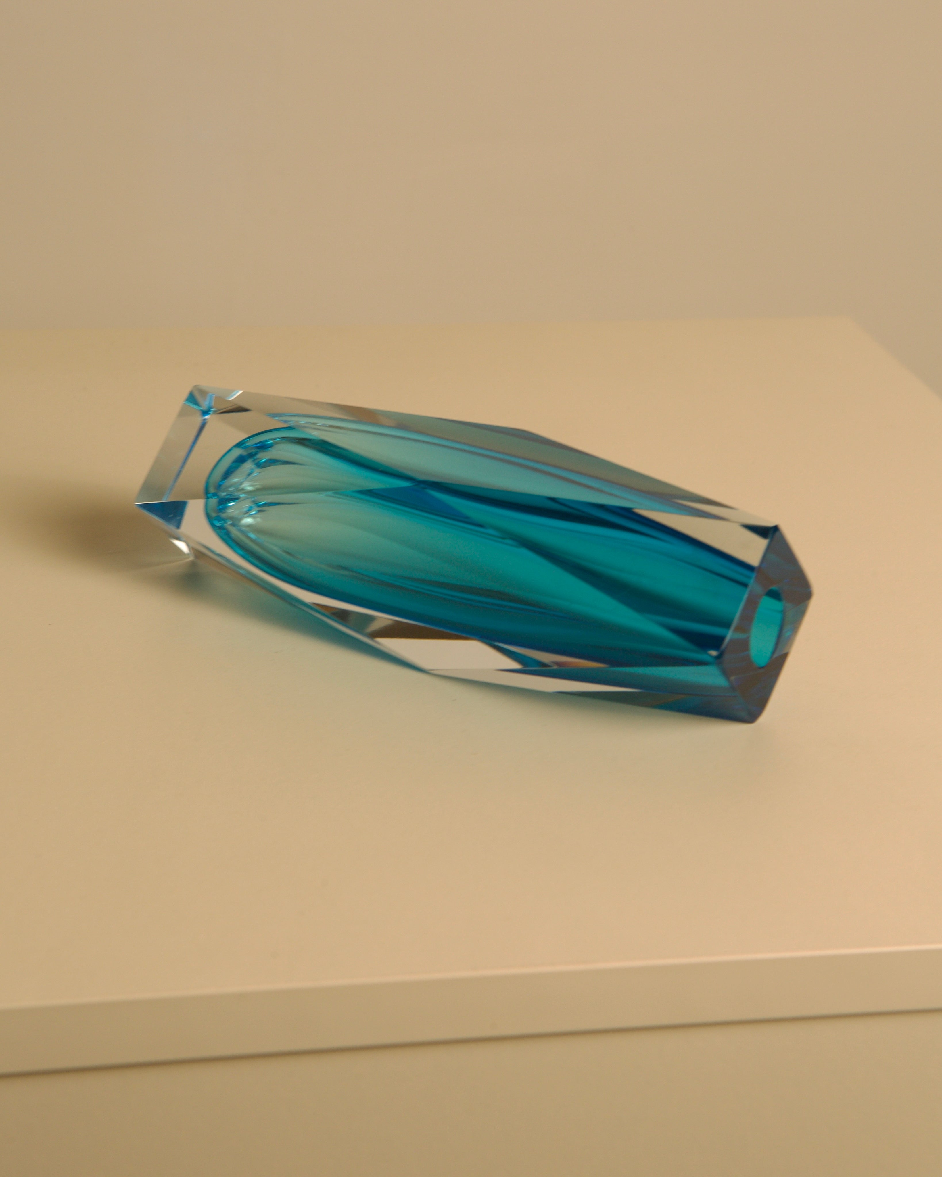 Turquoise Diamant vase by Flavio Poli profile view on beige surface