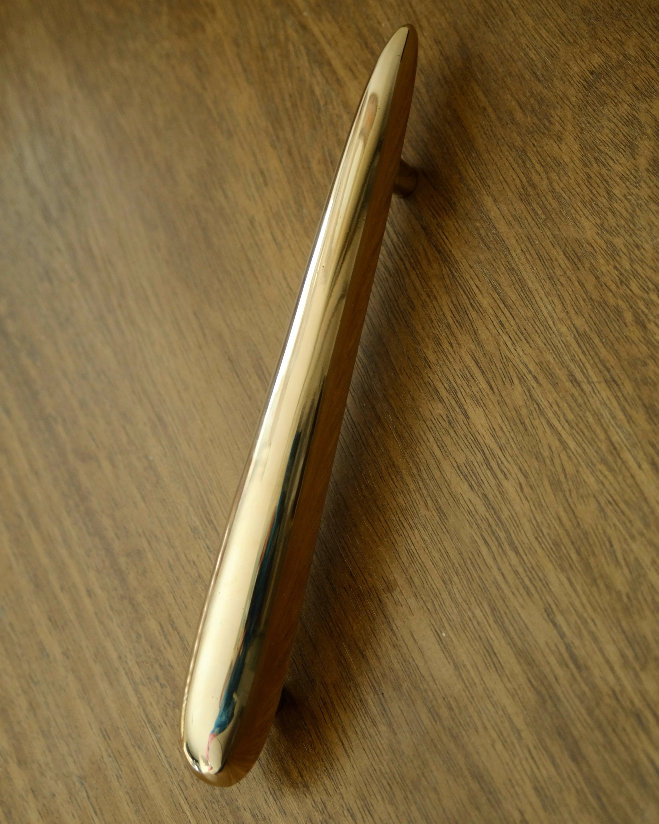 MOMI Cabinet/Appliance Pull Long — side angle of polished brass finish