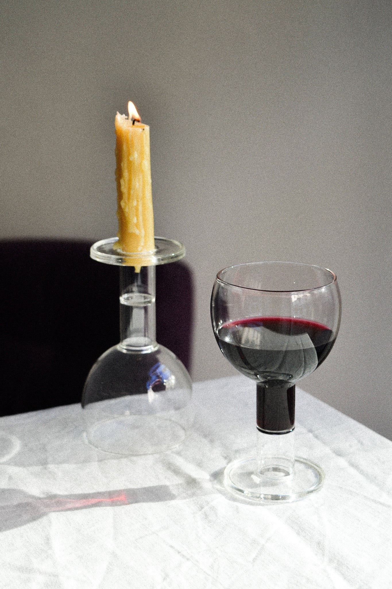 Set of 2 Wine Candle Glasses - Clear — close-up with red wine and candle