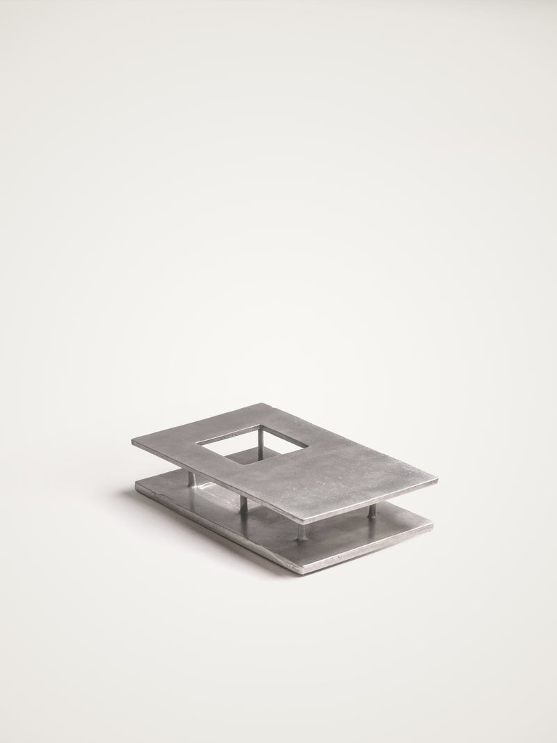 The Courtyard — close-up of brushed metal surface on display