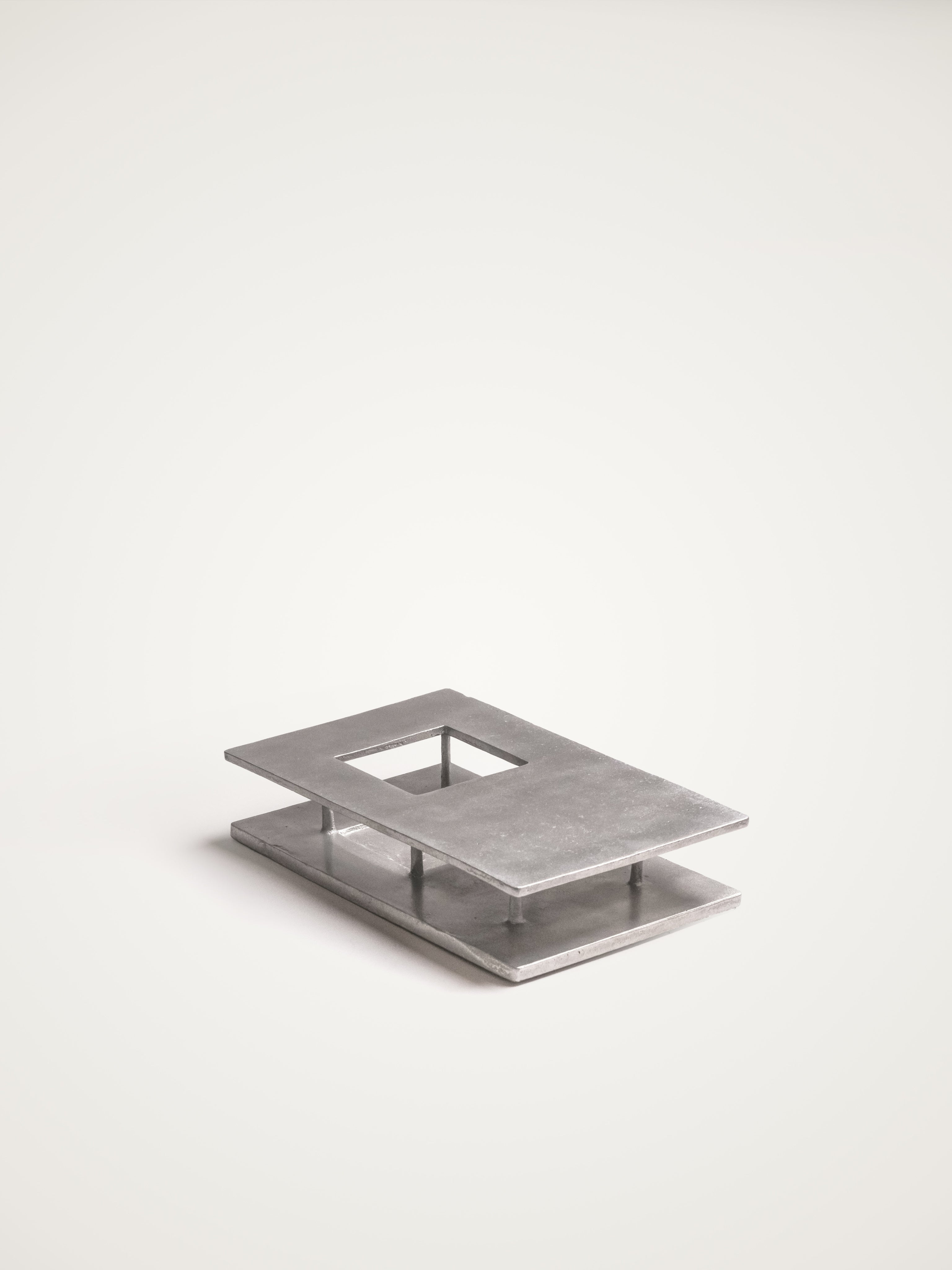 The Courtyard — close-up of brushed metal surface on display