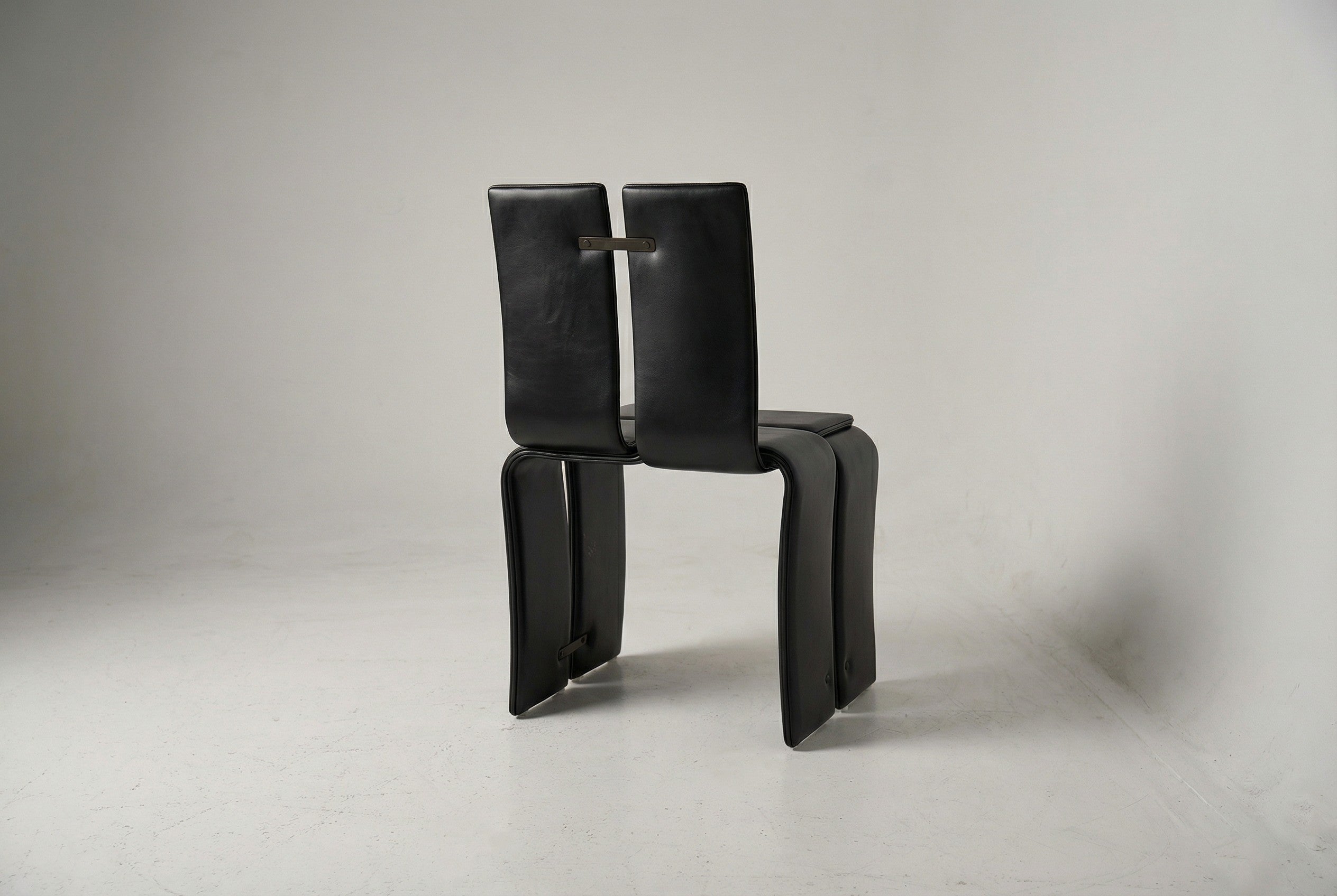 Weaving Chair - Leather — angled view highlighting black leather finish