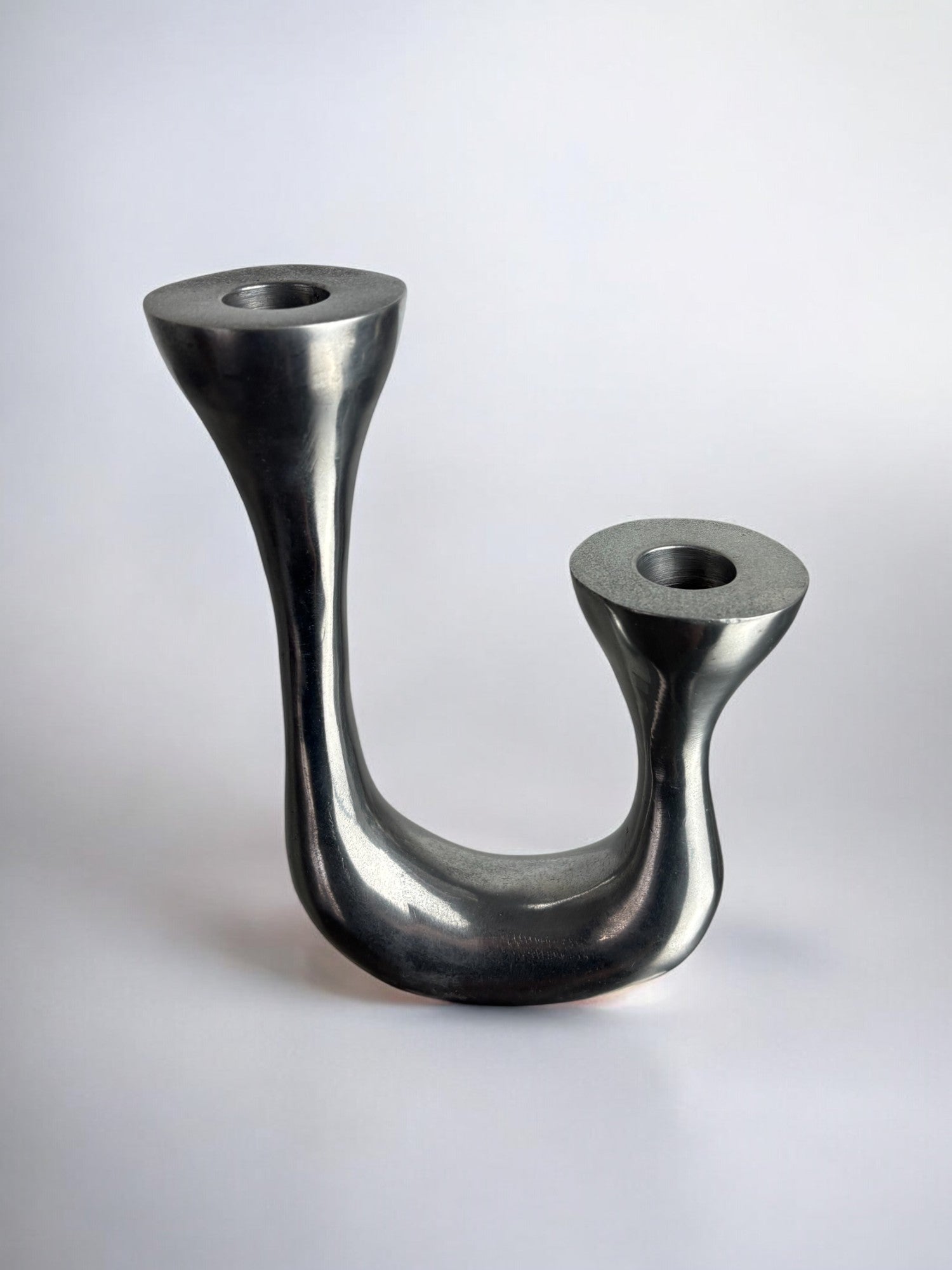 Biomorphic Candleholder, Aluminum, Spain, Circa 1970s — close-up of smooth metallic surface