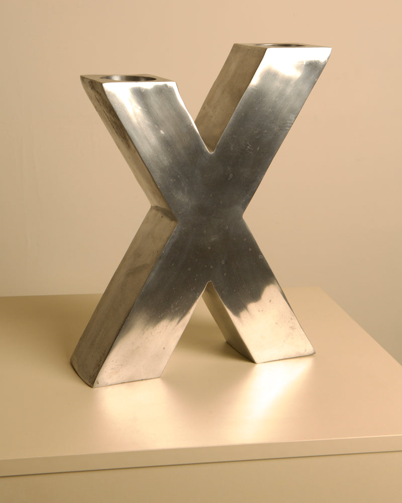 Large "X" Candleholder in Cast Aluminum 80's — close-up of polished aluminum surface