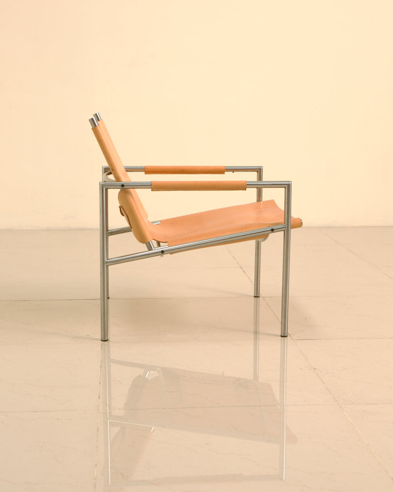 SZ02 armchair profile view showing tan leather sling seat design