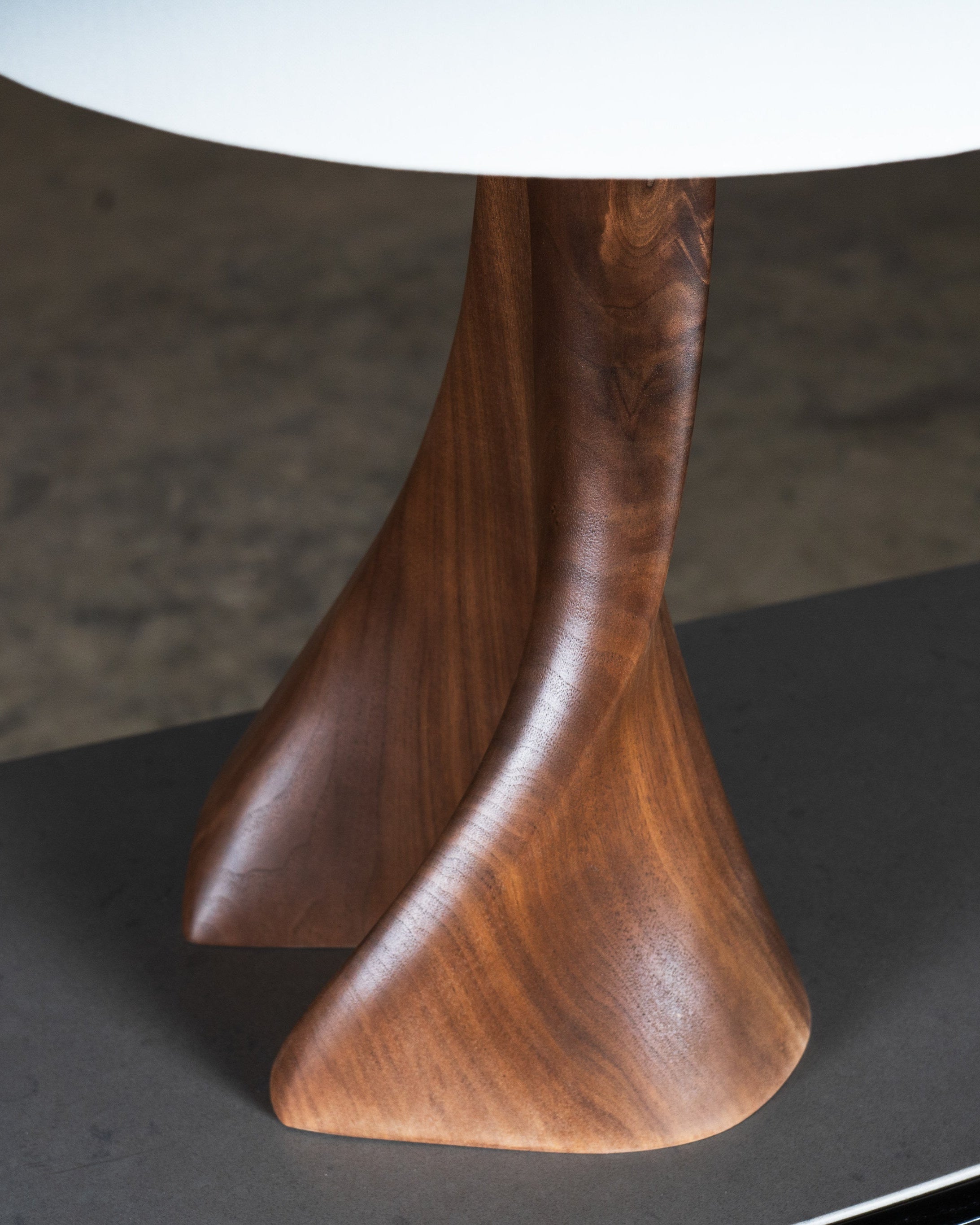 Nile Table Lamp in Natural Stain on Walnut Wood — side angle highlighting curved wooden base