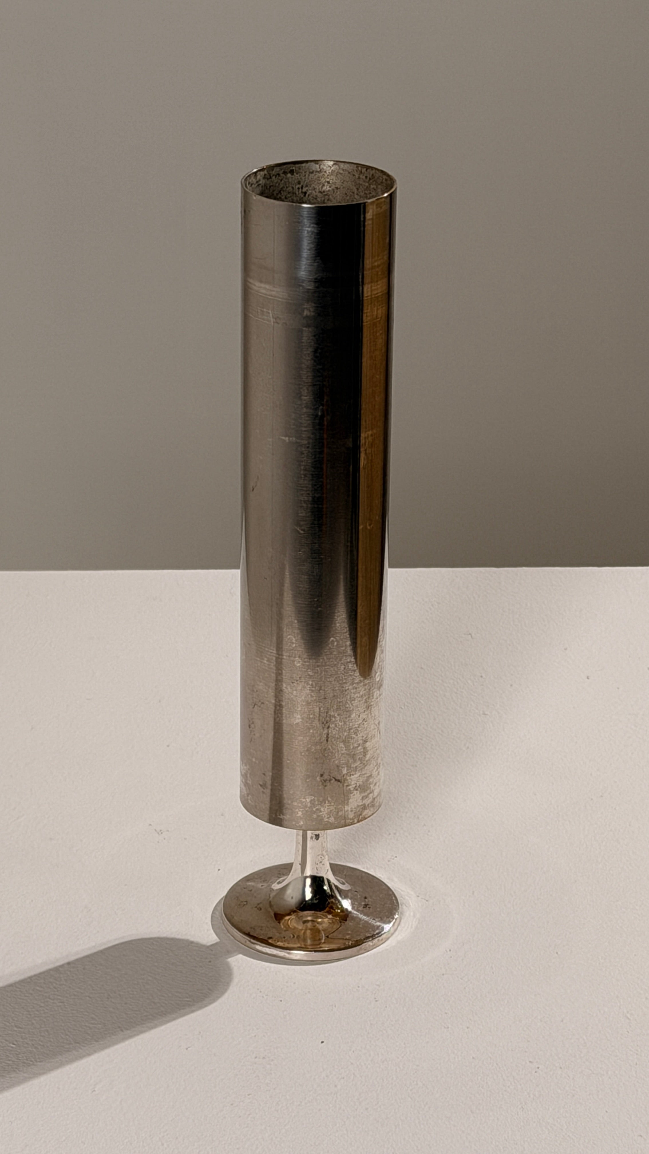 Large Silver-plated Metal Candleholder, France, circa 1970. — side view on white surface