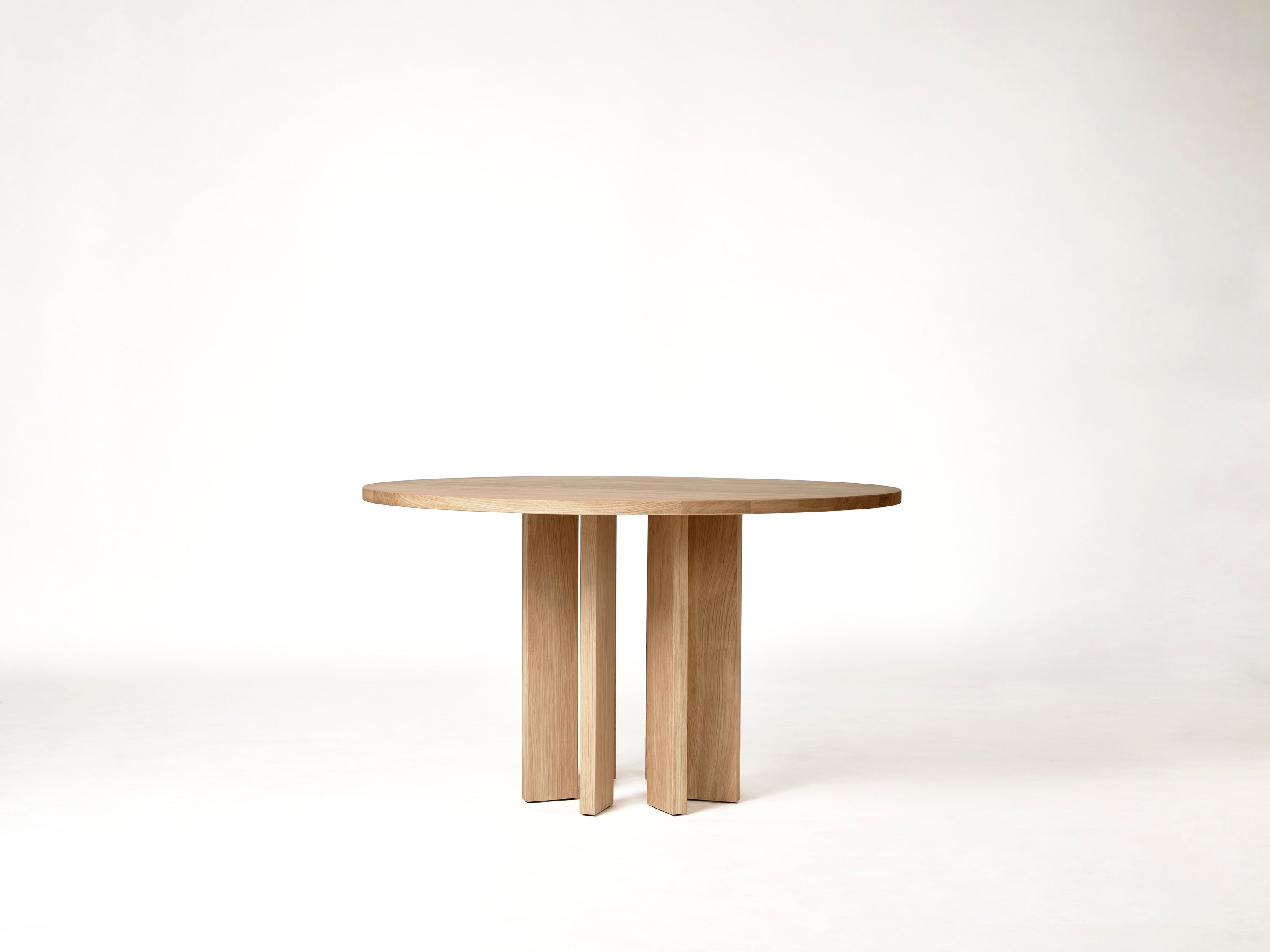 Thola Round Table — top view of natural wood finish