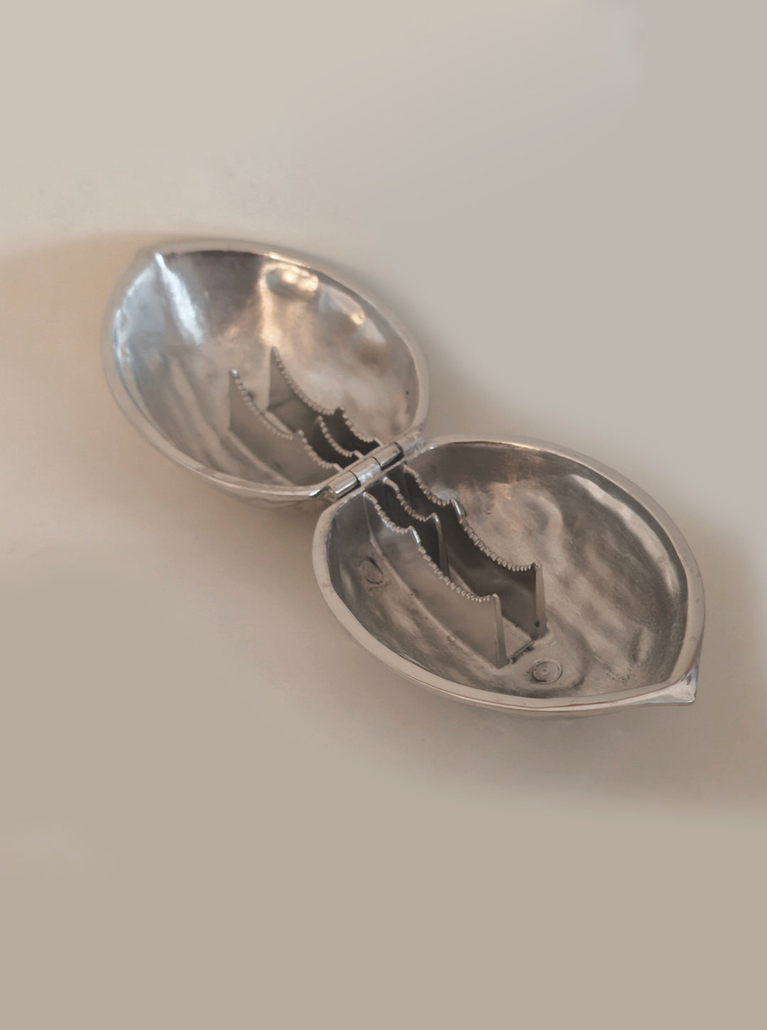 Stainless Steel Nutcracker — side angle showing polished interior and hinge