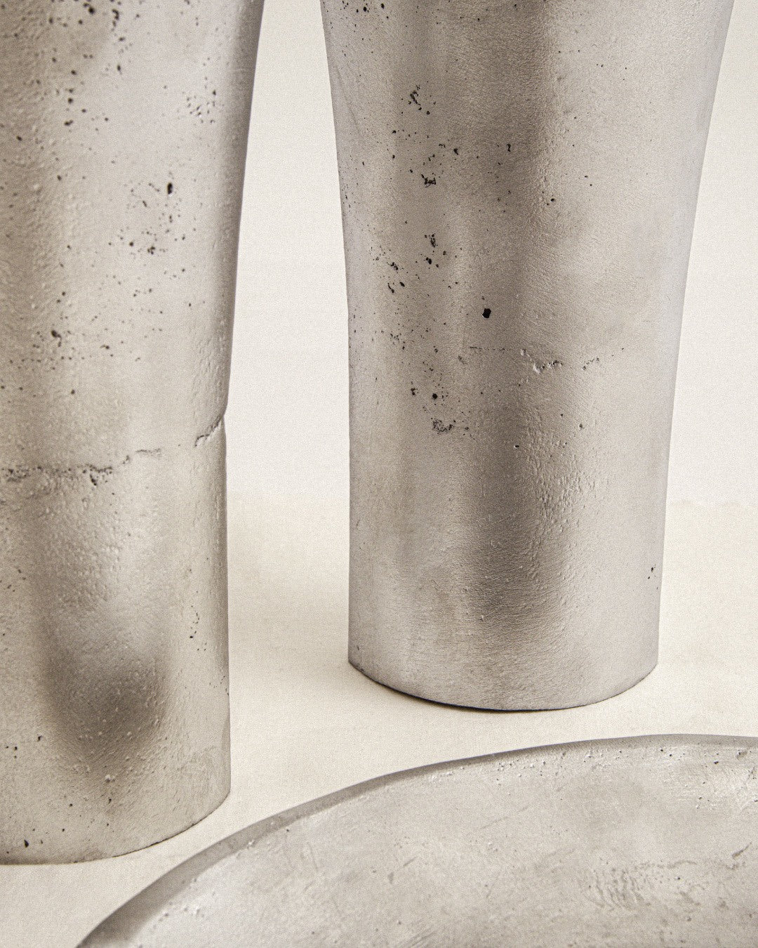Aluminium Candle Sculpture — side angle highlighting textured silver surface