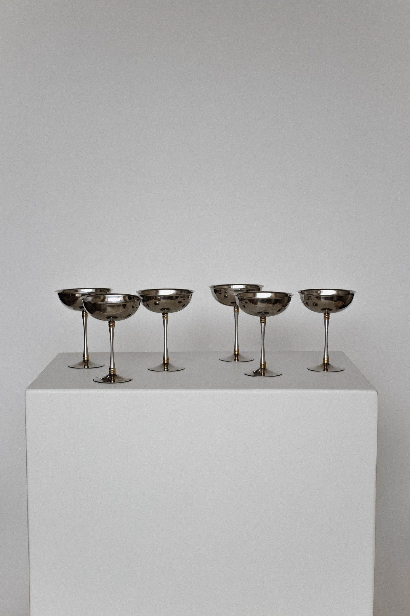 Set of 6 Large Ice Coupes — arranged on white pedestal with neutral background