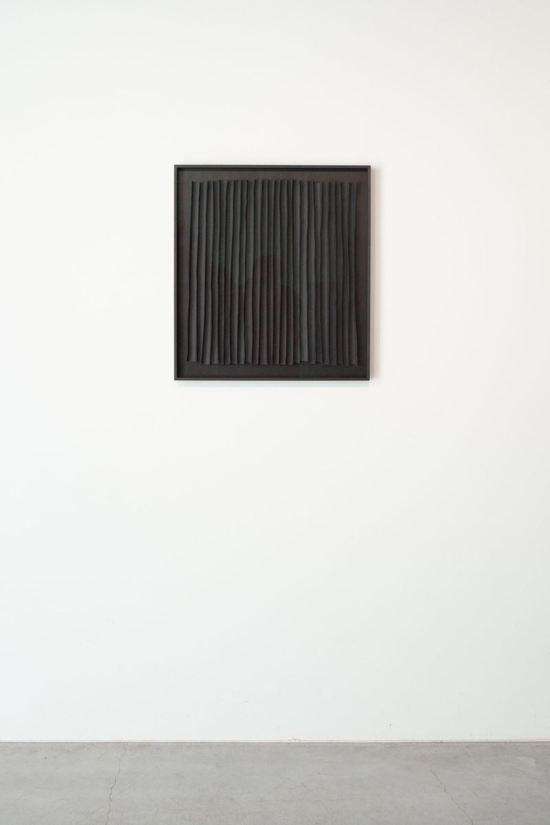 Rhythm Black' Paper Composition — close-up of black textured paper in frame