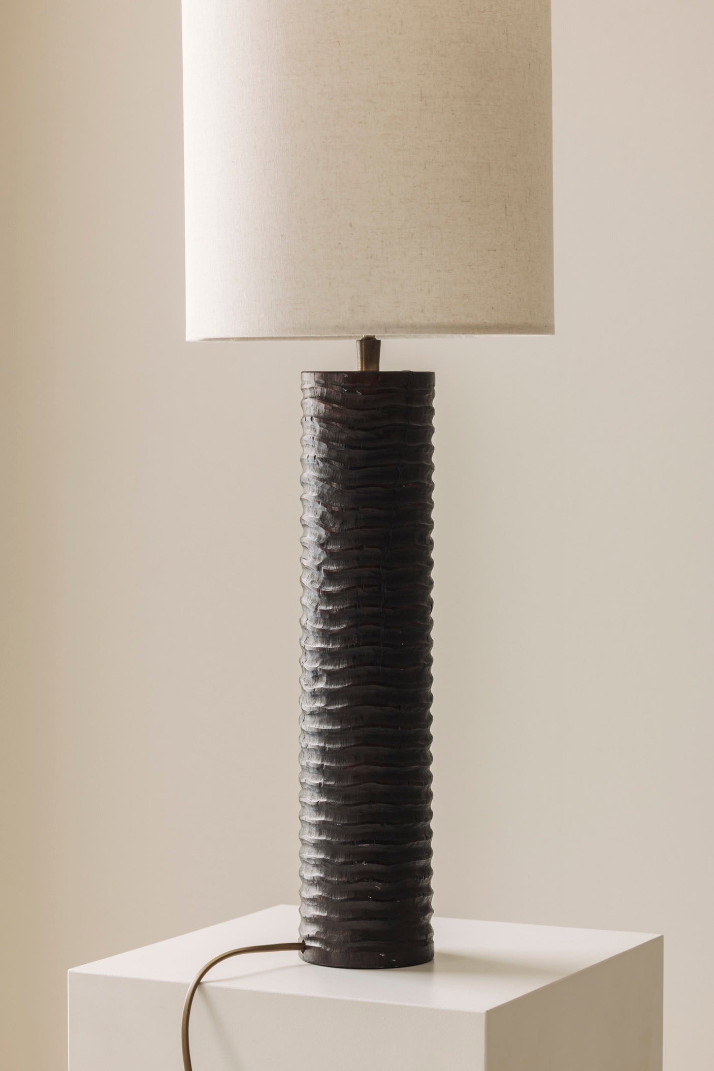 Elegant pair of French wooden carved table lamps from the 1970s. — lifestyle setting