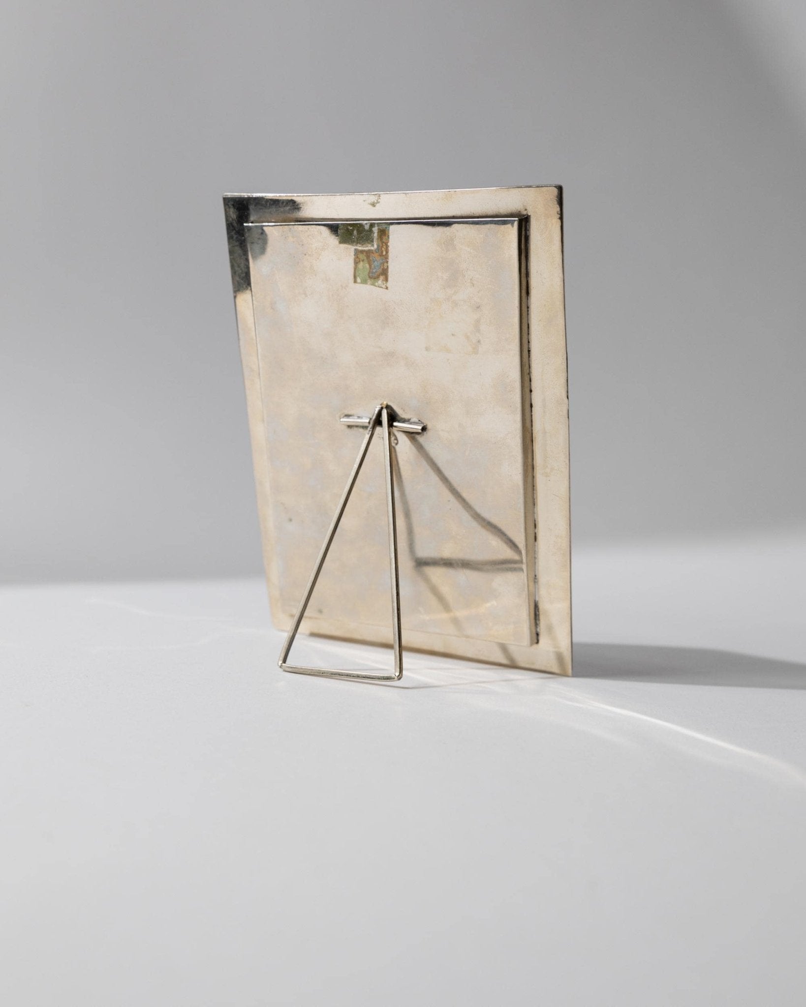 Vintage 1950s Alpaca Silver Picture Frame, Mother of Pearl Details with Oval Photo Opening, Elegant Table Accent, Timeless Gift Idea — side angle
