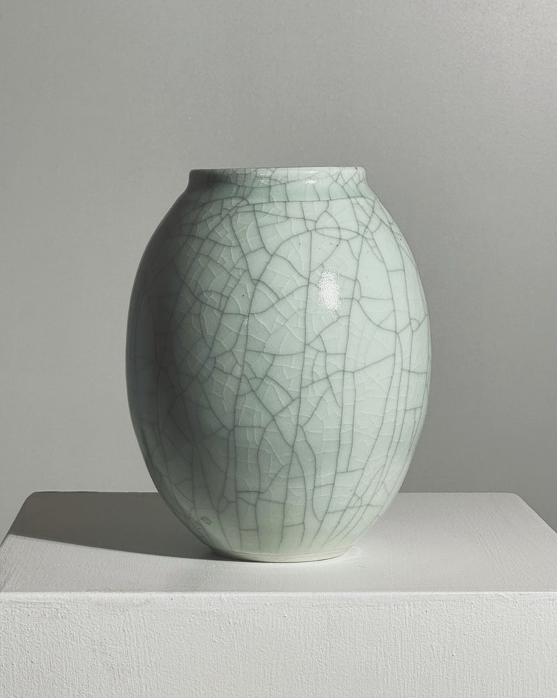 Crackled glaze detail of white ceramic vase by Roland Breton