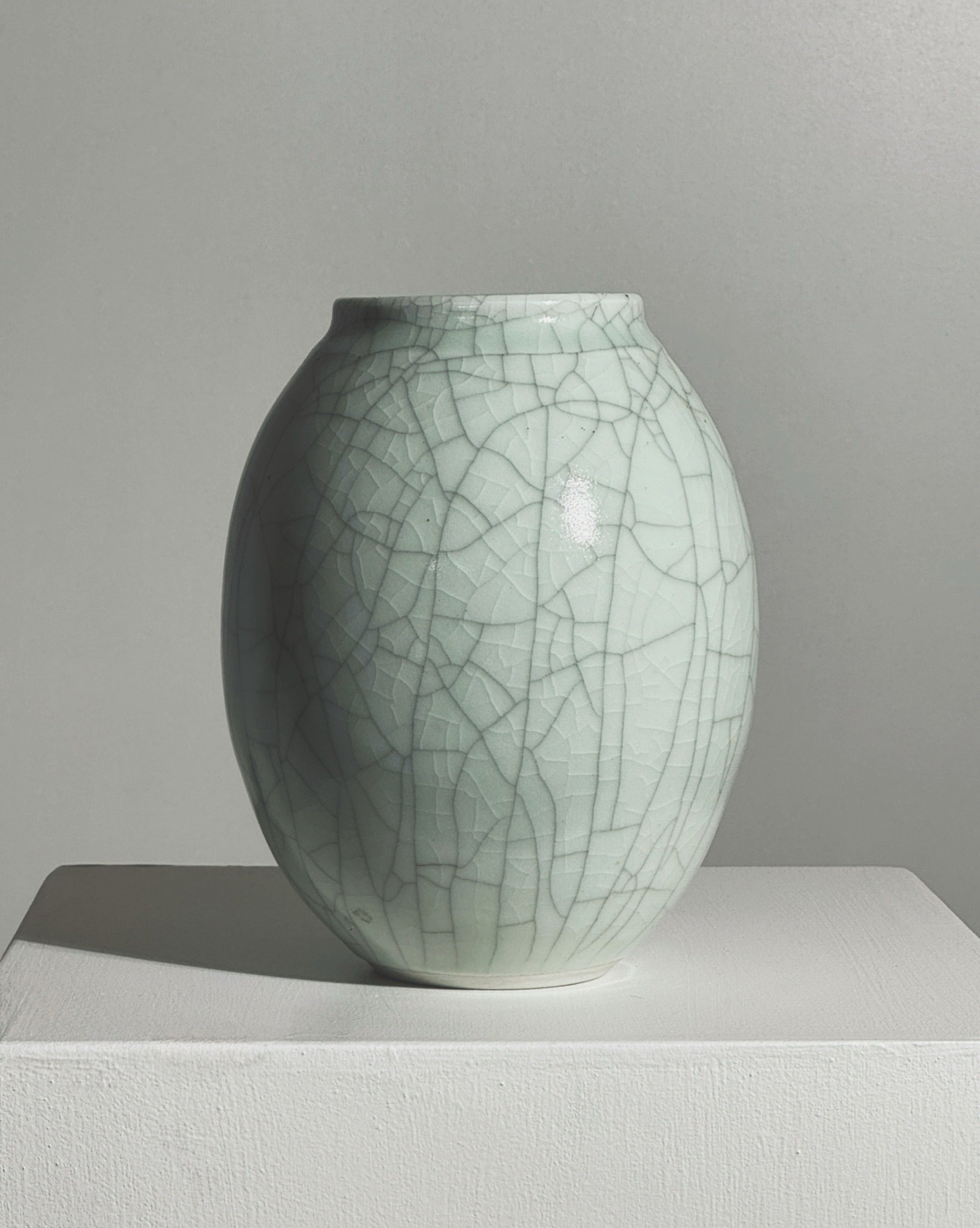 Crackled glaze detail of white ceramic vase by Roland Breton